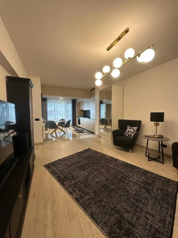 Închiriez Apartament Select Residence 2 camere full mobilat si utilat - Select Residence- Zona Dristor. Spre Închiriere un apartament nu a fost înlocuit niciodată, mutare imediata, finalizat noiembrie 2024, superb, cu 2 camere 70 m2 utili si o locatie excelenta, etaj 4/12, in zona Dristor - Dudesti in complexul Select Residence, modern, verde si foarte liniștita. Apartamentul se afla cu o distantă foarte aproape(600m) fata de metrou Dristor, transport in comun, parc, magazine, lângă București Mall Vitan, piața, unitate sanitara, scoală. Este alcătuit din: living luminos si foarte spațios, un dormitor, o baie moderna, cu finisaje de calitate, o bucătărie, un balcon de aproximativ 10,5 m2, hol, si multiple spatii de depozitare, full mobilata. Apartamentul dispune de: centrala termica proprie, aer condiționat Fujitsu cu comanda remote prin aplicație, gresie, faianța, parchet, ușa metalica, interfon cu video, 1 led TV Samsung 65”(163 cm), 1 led TV Samsung 50” (125 cm), Sound Bar Samsung, internet si cablu TV Digi, interior este absolut nou, mașina de spălat rufe Bosch, uscător Bosch frigider Bosch, hota telescopica incorporabila Bosch, cuptor incorporablila Bosch, plita cu inducție Bosch, bucătărie mobilata si utilata. Există plase de țânțari pe ambele uși ale balconului. Există un loc de parcare subterană pentru o mașină. Nu se accepta animale de companie. Garanție 950 euro + 1 luna de chirie 950 euro, contract înregistrat la ANAF Este ideal pentru un cuplu sau chiar o familie. Fără/exclus agenții, direct de la proprietarul, nu se percepe comision Va invit sa ma contactați pentru mai multe detalii si pentru a programa o vizionare.