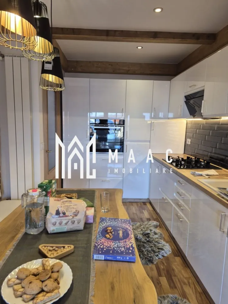 Casa 3 camere | 115 MPU | Teren 260 MP | Sibiel - MAAC Imobiliare vă propune spre vânzare o proprietate impresionantă, situată în pitorescul sat Sibiel. Amplasată într-o zonă montană superbă, această casă îmbină confortul modern cu liniștea naturii și priveliști spectaculoase. Detalii: Suprafață teren: 260 mp Suprafață utilă casă: 115 mp Compartimentare: Pivniță Parter: living luminos, baie cu geam pentru aerisire, bucătărie complet mobilată și utilată, terasă generoasă Mansardă: hol, 2 camere spațioase, baie cu cadă și geam pentru aerisire, balcon cu vedere panoramică Dotări și avantaje: Construcție nouă, cu materiale premium Orientare mixtă – lumină naturală pe tot parcursul zilei Spațiu verde ideal pentru relaxare în aer liber Se vinde complet mobilată și utilată Recomandată pentru: Familie care caută liniște și natură, dar aproape de Sibiu Investiție sigură în zona turistică Sibiel Închiriere pentru turiști sau evenimente private Pentru mai multe detalii sau pentru a programa o vizionare, vă rugăm să ne contactați. Specificați ID-ul CP2702190. }}