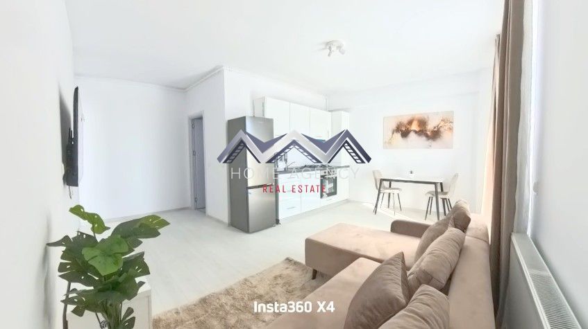 Apartament 2 camere | prima închiriere | include parcare - Dacă îți dorești un apartament modern, luminos, spațios și aflat la prima închiriere, acesta este locul perfect pentru tine! Acest apartament cu 2 camere, situat într-o zonă accesibilă și bine conectată către toate zonele de interes din Otopeni și din jur, este pregătit să devină noul tău "acasă". Aflat la etajul 2 din 3, cu o suprafață utilă de 46 mp și un balcon generos de 4.8 mp, îmbină armonios confortul, funcționalitatea și eleganța. Living-ul deschis, integrat cu bucătăria și zona de dining, oferă un spațiu primitor, ideal atât pentru momente de relaxare, cât și pentru seri petrecute alături de cei dragi. Ferestrele ample permit luminii naturale să inunde întreaga încăpere, iar orientarea spre Sud garantează lumină pe tot parcursul zilei. Balconul devine astfel un refugiu perfect pentru dimineți liniștite sau seri petrecute în aer liber. Fiind la prima închiriere, apartamentul se prezintă impecabil, amenajat cu atenție la detalii și dotat cu toate facilitățile necesare unui stil de viață confortabil. În plus, dispune de un loc de parcare dedicat, astfel încât vei scăpa de grija găsirii unui loc liber, iar accesul către punctele cheie ale orașului rămâne rapid și ușor. 📞 Programează o vizionare și descoperă chiar tu avantajele acestui apartament!