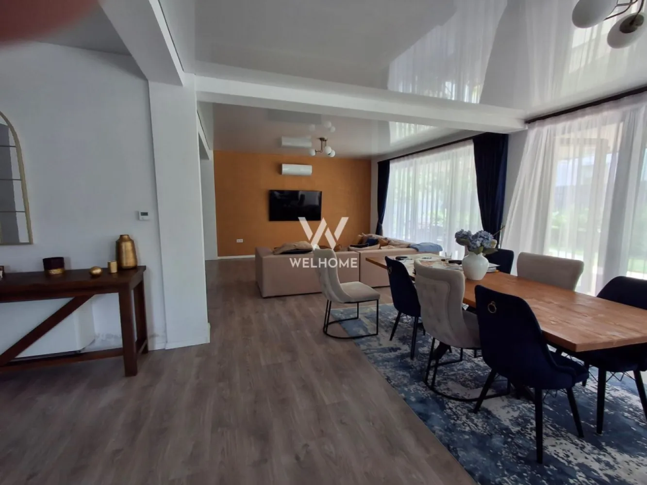 Casa SMART ,individuala de vanzare in Daia Noua, Sibiu - În inima satului Daia Nouă, la doar câțiva pași de vibrația Sibiului, se ridică o casă ce pare desprinsă dintr-un vis modern și totuși ancorat în liniștea naturii. O locuință inteligentă, independentă, cu suflet verde – apă cristalină din adâncul pământului, la 120 de metri, lumină solară prinsă în panourile de 8 kW, căldură difuză în pardoseală, purtată de o pompă de căldură ce transformă fiecare anotimp într-o binecuvântare.

Pe un teren intravilan generos, de 1007 mp, cu o deschidere largă de 50 m, se deschide o curte de 880 mp ce respiră libertate și promisiuni de seri liniștite. Casa, cu o suprafață utilă de 241 mp, își desfășoară povestea pe două niveluri, cu patru camere luminoase – trei dormitoare pregătite să adăpostească vise, trei băi elegante, o bucătărie ce invită la bucuria meselor împărtășite și trei balcoane ce se deschid către priveliști senine.

Fiecare colț este o declarație de lux și rafinament – mobilată complet, cu finisaje ultramoderne și de calitate superioară, casa îmbină poezia intimității cu siguranța tehnologiei.

Și totuși, poate cea mai mare frumusețe nu e doar între ziduri, ci în locul în care se află: o zonă superbă, unde dealurile îmbrățișează cerul, unde diminețile au parfum de început curat și unde seara, liniștea e cel mai prețios vecin.

Această casă nu este doar o proprietate de vânzare – este un refugiu pentru cei care caută libertatea, frumusețea și armonia dintre modern și etern.

Pret 400. 000 euro, negociabil

Pentru vizionare si detalii 0740066818 Cristina