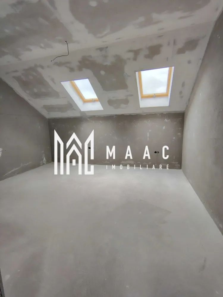 Casa Rezidentiala |5 Camere | Parcare |Sura Mica - MACC IMOBILIARE vă oferă spre vânzare Casa C2 este o locuință cuplată tip P+M, ideală pentru o familie care caută echilibru între spațiu, confort și intimitate. - Teren total: 328,93 mp - Amprentă la sol: 113,08 mp - Teren liber: ~119,5 mp - 2 locuri de parcare pavate în curte (față) -Zonă BBQ pavata în curtea din spate - Acces pe drum privat propriu - Front stradal: 9,8 m Compartimentare interioară – 156,29 mp utili: Parter: Hol – 14,89 mp Cameră de zi – 39,85 mp Bucătărie – 10,57 mp (open-space cu livingul) Cameră – 16,5 mp Baie – 6,71 mp Scară interioară de acces mansardă Mansardă: Hol – 17,26 mp Baie – 5,08 mp Birou – 10,17 mp Dormitor 1 – 17,14 mp Dormitor 2 – 18,12 mp Înălțime utilă etaj: de la 1,69 m la 3,10 m Caracteristici și dotări – Casa C2, construcție nouă 2025, semifinisată: Centrală termică pe gaz Ferroli Încălzire în pardoseală Viega la parter Radiatoare de aluminiu la mansardă Instalații electrice complete (curenți tari și slabi, tablou electric trifazic) Instalație sanitară completă (fără obiecte sanitare) Infrastructură pentru termostate Ușă metalică la intrare Tâmplărie termoizolantă Salamander (7 camere), geamuri mari, triplu vitraj (3 foi sticlă, garnituri izolante, Low-E), feronerie Roto - Pereți tencuiți, șapă mecanizată - Fațade cu tencuială decorativă - Acoperiș din țiglă ceramică - Scări din beton - Terasă acoperită și pavata Contoare individuale montate la limita proprietății (apă, gaz, electricitate) -Rețea electrică nouă + post de transformare propriu -Împrejmuire individuală – intimitate față de vecini Avantaje cheie: - Compartimentare modernă și funcțională - Lumină naturală din abundență - Intimitate și confort optim pentru o familie - Acces rapid spre orașul Sibiu Finalizare în 2025 – livrare semifinisată, pregătită pentru personalizarea finisajelor }}
