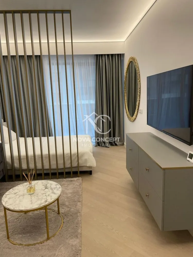 Studio COrtina North Bulevardul Pipera - Ofer spre închiriere studio în complexul Cortina North
Apartamentul este pregătit pentru mutare imediată. 
Dispune de: veselă, pahare, tacâmuri, aspirator, mop, fier și masă de călcat, uscător de rufe etc.

Prețul variază în funcție de modalitatea de plată aleasă:
• 600 Euro/lună (pentru plata integrală pe 1 an)
• 630 Euro/lună (pentru plata la fiecare 6 luni)
• 650 Euro/lună (pentru plata la fiecare 2 luni)

Condiții:
• Contract minim 1 an.
• Garanție: contravaloarea unei luni de chirie.
• Nu se acceptă animale de companie.