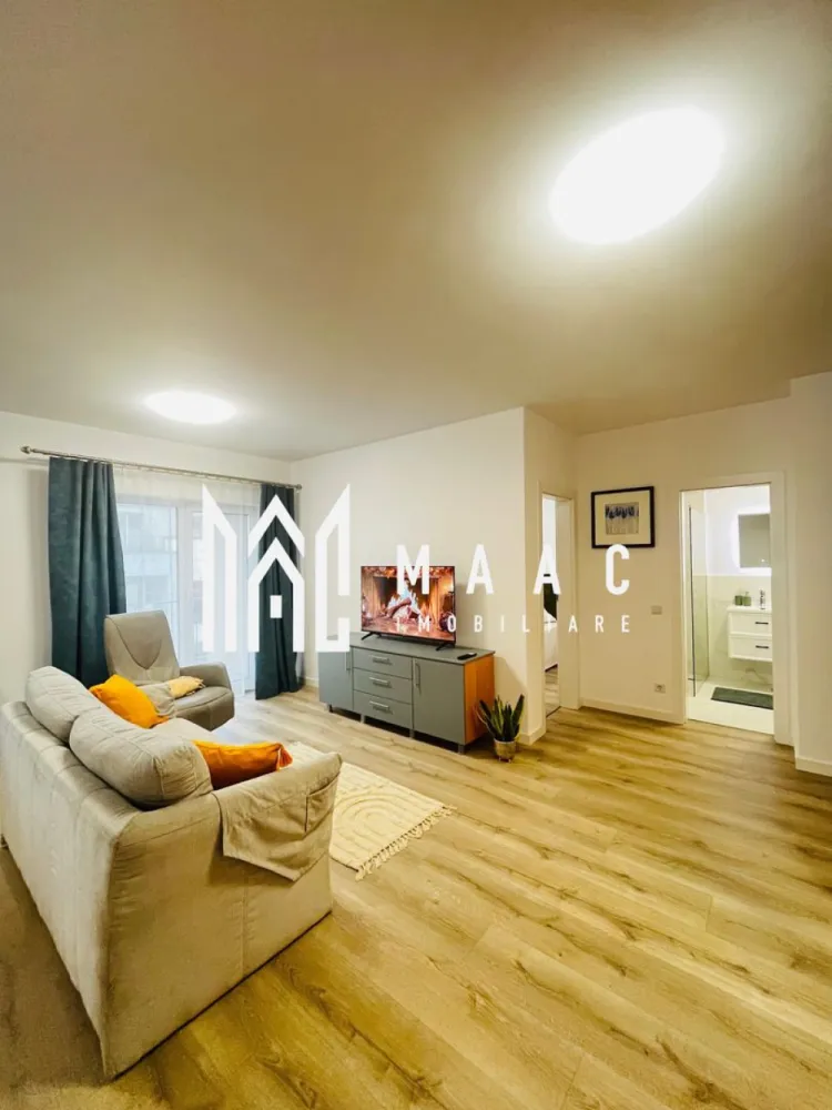 Apartament 2 camere | 54 MPU | Turnisor\Neppendorf - MAAC Imobiliare vă propune spre închiriere un apartament modern, luminos și bine compartimentat, situat într-un imobil nou din zona Neppendorf, Sibiu. Proprietatea este ideală pentru un cuplu sau o persoană activă, oferind confort, funcționalitate și acces facil atât către centrul orașului, cât și către autostradă.

Compartimentare:
living generos open space cu bucătărie
dormitor confortabil
baie spațioasă
hol de intrare
balcon cu acces din living

Dotări și avantaje:
apartament complet mobilat și utilat
mașină de spălat rufe
mașină de spălat vase
frigider
cuptor electric
plită electrică
televizor
Wi-Fi
încălzire în pardoseală
clasă energetică A
loc de parcare inclus
imobil dotat cu lift

Suprafață:
54 mp + balcon

Localizare:
Neppendorf, Sibiu – zonă liniștită, cu acces facil către principalele puncte de interes ale orașului

Condiții de închiriere:
preț: 490 €/lună
garanție: echivalentul unei chirii lunare
disponibilitate: 1 iunie

Pentru mai multe detalii sau pentru programarea unei vizionări, vă rugăm să ne contactați specificând: ID: CP3070129
