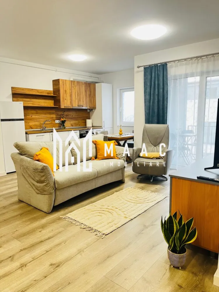 Apartament 2 camere | 54 MPU | Turnisor\Neppendorf - MAAC Imobiliare vă propune spre închiriere un apartament modern, luminos și bine compartimentat, situat într-un imobil nou din zona Neppendorf, Sibiu. Proprietatea este ideală pentru un cuplu sau o persoană activă, oferind confort, funcționalitate și acces facil atât către centrul orașului, cât și către autostradă.

Compartimentare:
living generos open space cu bucătărie
dormitor confortabil
baie spațioasă
hol de intrare
balcon cu acces din living

Dotări și avantaje:
apartament complet mobilat și utilat
mașină de spălat rufe
mașină de spălat vase
frigider
cuptor electric
plită electrică
televizor
Wi-Fi
încălzire în pardoseală
clasă energetică A
loc de parcare inclus
imobil dotat cu lift

Suprafață:
54 mp + balcon

Localizare:
Neppendorf, Sibiu – zonă liniștită, cu acces facil către principalele puncte de interes ale orașului

Condiții de închiriere:
preț: 490 €/lună
garanție: echivalentul unei chirii lunare
disponibilitate: 1 iunie

Pentru mai multe detalii sau pentru programarea unei vizionări, vă rugăm să ne contactați specificând: ID: CP3070129