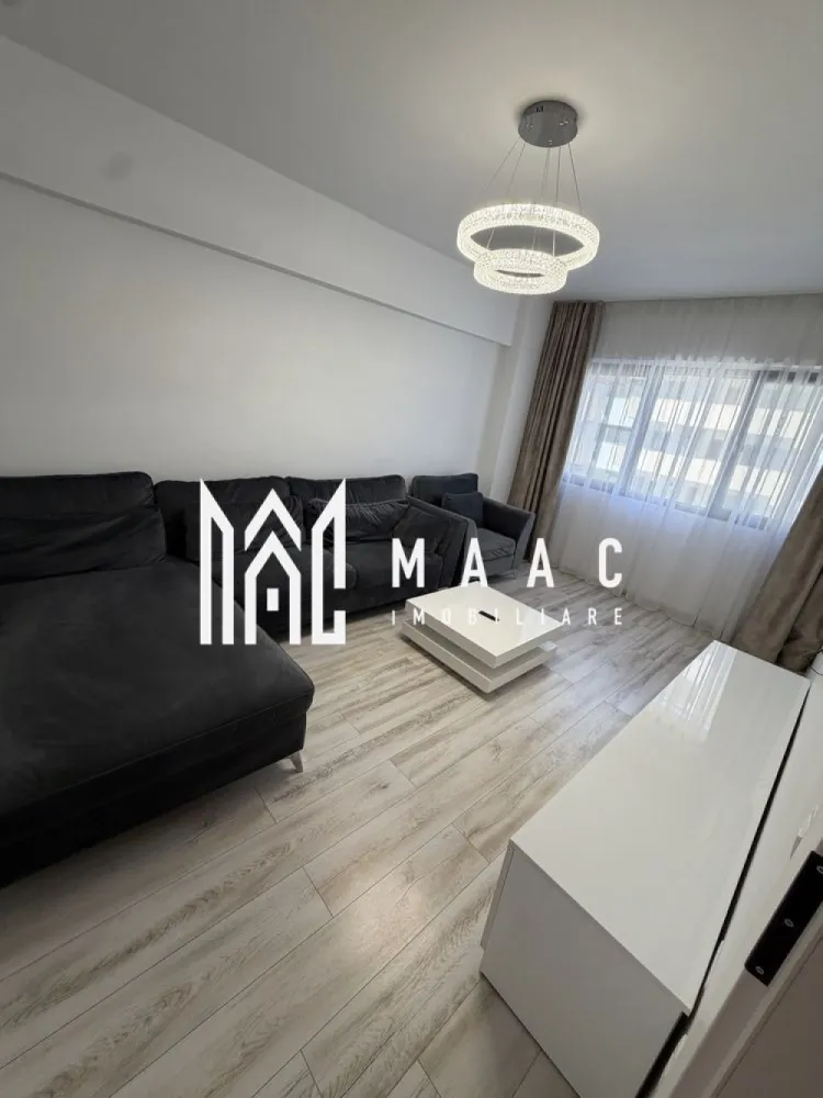 INCHIRIERE APARTAMENT 2 camere| Dem Radulescu Ramnicu Valcea - MAAC Imobiliare vă propune spre vânzare un apartament tip garsonieră cu două camere, cu o suprafață de 60 de metri pătrați, situat la etajul 3 al unui bloc construit după anul 2000. Proprietatea se remarcă printr-un interior luminos, finisaje de înaltă calitate și o amenajare contemporană, potrivită pentru locuire confortabilă într-o zonă urbană bine conectată.

Locuința dispune de pardoseli laminate, ferestre mari și spații bine iluminate natural. Camera de zi și dormitorul oferă un ambient plăcut, cu decor modern, iar balconul completează apartamentul printr-o vedere urbană și un spațiu potrivit pentru relaxare.

Compartimentarea și dotările includ:
-suprafață de 60 de metri pătrați
-etaj 3
-bloc construit după anul 2000
-cameră de zi luminoasă
-dormitor cu ferestre mari
-bucătărie cu pereți albi și podea din plăci ceramice
-baie echipată cu obiecte sanitare și plăci de ceramică albe
-pardoseli laminate
-finisaje de înaltă calitate
-balcon cu vedere urbană

Apartamentul beneficiază de o poziție excelentă în oraș, în apropiere de centre culturale, restaurante, cafenele și magazine. Zona oferă acces facil către parcuri, școli, instituții medicale și facilități pentru petrecerea timpului liber, ceea ce transformă această proprietate într-o variantă practică pentru cei care caută o locuință aproape de puncte importante de interes.

Transportul public este accesibil, cu stații de autobuz și tren aflate în apropiere, asigurând conexiuni rapide către alte zone ale orașului. Datorită amplasării, suprafeței generoase și caracteristicilor interioare, această garsonieră cu două camere reprezintă o opțiune potrivită pentru locuire într-un spațiu confortabil, modern și bine poziționat.

Pentru mai multe detalii și programarea unei vizionări, vă rugăm să ne contactați telefonic și să menționați codul CP3069239.