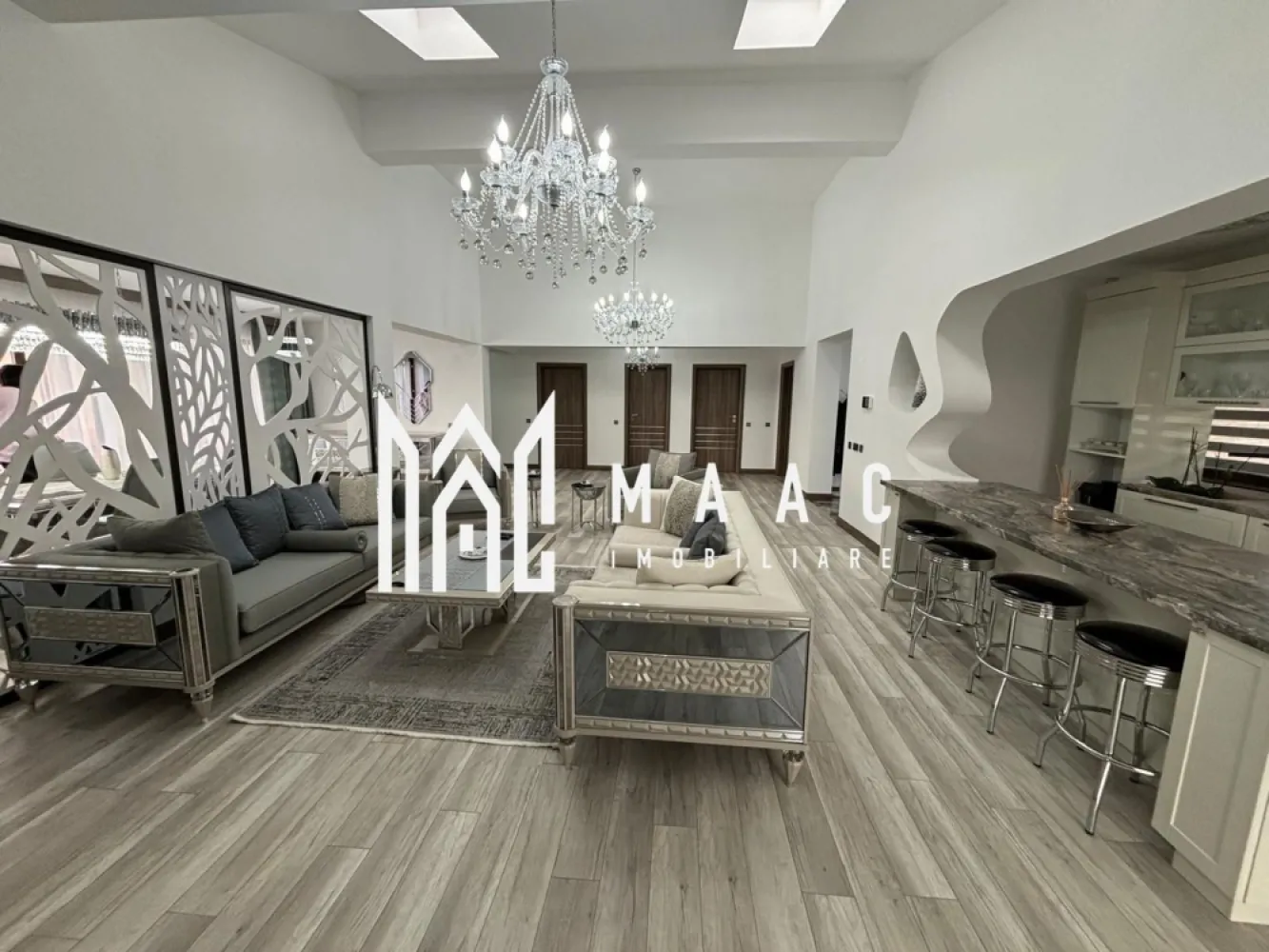 Casa /Vila de Lux | Teren 630 mp | Sibiu - MAAC Imobiliare vă invita să descoperiți o vilă exclusivistă, situată într-o locație privilegiată, la doar cateva minute de centrul orașului, care îmbină eleganța, confortul și funcționalitatea într-un design contemporan. Cu o suprafață utilă de 196,3 mp și un teren generos, această proprietate oferă un stil de viață rafinat, într-un cadru liniștit și accesibil. Caracteristici principale: Suprafață utilă: 196,3 mp, distribuiți eficient pe un nivel și un subsol amenajat Teren generos: 630 mp, ideal pentru grădină, loc de relaxare, sau pentru organizarea de evenimente în aer liber Compartimentare excelentă: La parter: un living spațios și luminos, perfect pentru relaxare sau întâlniri sociale, și o zonă de dining elegantă, care se deschide către o bucătărie complet echipată 3 dormitoare care beneficiază de baie proprie si dressing. două bucătării situate la parter, ideală pentru gătit în familie sau pentru a vă bucura de momente de socializare, iar a treia este amplasată la subsol, perfectă pentru prepararea meselor pentru petreceri sau întâlniri cu prietenii. Subsol amenajat: Un spațiu versatil pentru evenimente, cu un sistem de iluminat ambiental Finisaje de lux: utilizarea celor mai bune materiale și tehnici de construcție, inclusiv parchet , marmură de calitate superioară, feronerie premium, și instalații de iluminat moderne. Fiecare cameră este luminată natural, datorită geamurilor mari și a designului deschis, creând un ambient plăcut și primitor. Curte proprie: cu suficiente spații verzi pentru a crea o grădină privată sau loc de joacă, având totodată opțiunea de a amenaja o piscină sau terasă exterioară. Avantaje suplimentare: Locație excelentă: la doar 5 minute de oraș, vă veți bucura de acces rapid la toate facilitățile urbane, păstrând în același timp liniștea și intimitatea unei locuințe exclusiviste, înconjurată de natură. Locuri de parcare: spațiu generos pentru parcare, inclusiv locuri de parcare pentru vizitatori. Pentru mai multe informatii specificati ca ati vazut anuntul cu ID: CP2218499 }}