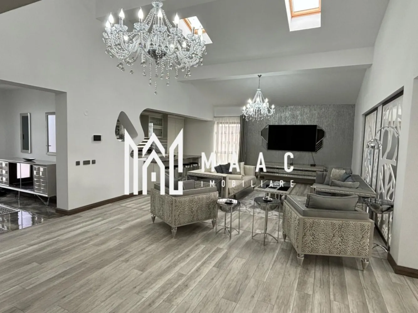 Casa /Vila de Lux | Teren 630 mp | Sibiu - MAAC Imobiliare vă invita să descoperiți o vilă exclusivistă, situată într-o locație privilegiată, la doar cateva minute de centrul orașului, care îmbină eleganța, confortul și funcționalitatea într-un design contemporan. Cu o suprafață utilă de 196,3 mp și un teren generos, această proprietate oferă un stil de viață rafinat, într-un cadru liniștit și accesibil. Caracteristici principale: Suprafață utilă: 196,3 mp, distribuiți eficient pe un nivel și un subsol amenajat Teren generos: 630 mp, ideal pentru grădină, loc de relaxare, sau pentru organizarea de evenimente în aer liber Compartimentare excelentă: La parter: un living spațios și luminos, perfect pentru relaxare sau întâlniri sociale, și o zonă de dining elegantă, care se deschide către o bucătărie complet echipată 3 dormitoare care beneficiază de baie proprie si dressing. două bucătării situate la parter, ideală pentru gătit în familie sau pentru a vă bucura de momente de socializare, iar a treia este amplasată la subsol, perfectă pentru prepararea meselor pentru petreceri sau întâlniri cu prietenii. Subsol amenajat: Un spațiu versatil pentru evenimente, cu un sistem de iluminat ambiental Finisaje de lux: utilizarea celor mai bune materiale și tehnici de construcție, inclusiv parchet , marmură de calitate superioară, feronerie premium, și instalații de iluminat moderne. Fiecare cameră este luminată natural, datorită geamurilor mari și a designului deschis, creând un ambient plăcut și primitor. Curte proprie: cu suficiente spații verzi pentru a crea o grădină privată sau loc de joacă, având totodată opțiunea de a amenaja o piscină sau terasă exterioară. Avantaje suplimentare: Locație excelentă: la doar 5 minute de oraș, vă veți bucura de acces rapid la toate facilitățile urbane, păstrând în același timp liniștea și intimitatea unei locuințe exclusiviste, înconjurată de natură. Locuri de parcare: spațiu generos pentru parcare, inclusiv locuri de parcare pentru vizitatori. Pentru mai multe informatii specificati ca ati vazut anuntul cu ID: CP2218499 }}