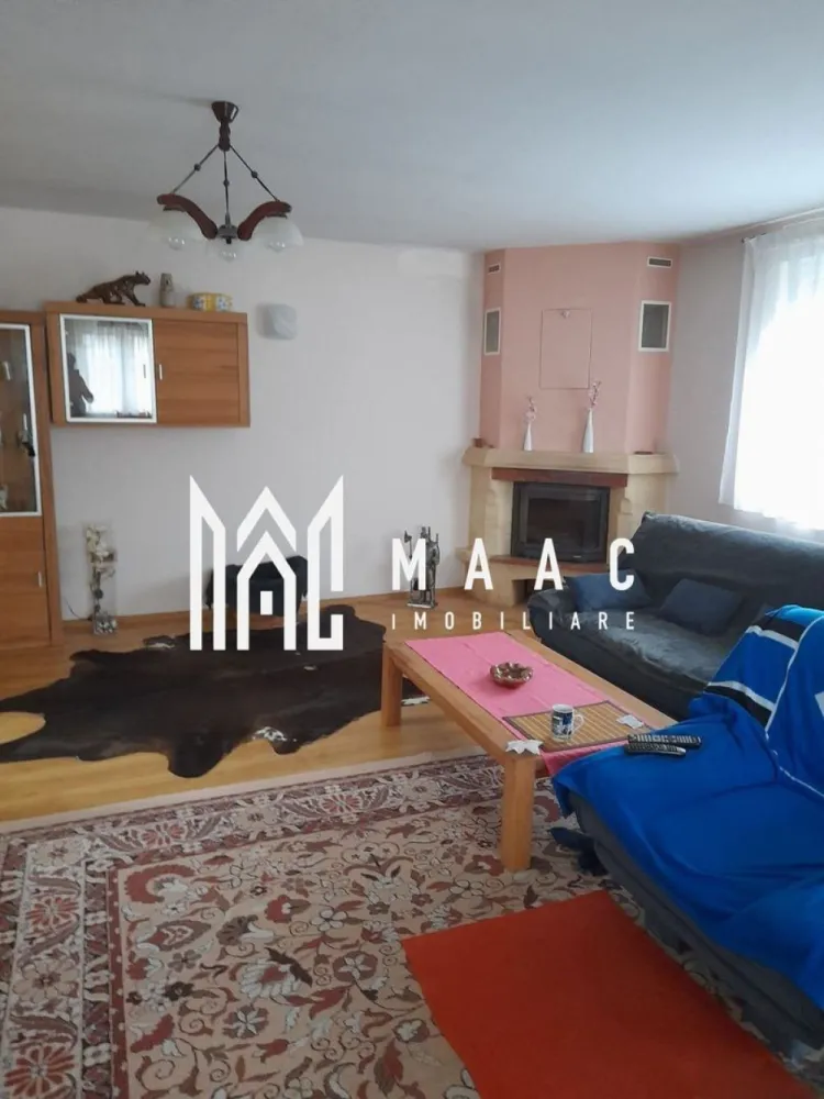Casa individuala | 7 camere | Alma, Judetul Sibiu - MAAC Imobiliare vă propune spre vanzare o casa cu 7 camere, amplasată în comuna Alma, într-o zonă liniștită și plină de farmec. Construită în 2013, această proprietate este ideală pentru cei care caută un cămin confortabil, bine compartimentat. Cu regim de inaltime S+P+M, proprietatea are o pivnita racoroasa si un bar amenajat la subsol; la parter (115mp) gasim un garaj spatios, cu acces in casa, hol, living cu semineu, bucatarie moderna, dormitor si 2 bai (una mare, cu dus si cada, alta de serviciu); mansarda (90 mp)-3 dormitoare, hol, baie cu dus, balcon, acces la pod, terasa acoperita. In curte-anexă care include: bucătărie de vară, atelier, copertină pentru lemne. Dotari: curent trifazic, centrală termică pe gaz, semineu, panou solar pentru apă caldă menajeră, geamuri termopan cu rulouri, apă curentă și canalizare, conectate la rețeaua locală. Grădina generoasă, de 800 m², e amenajată cu pomi fructiferi și viță de vie. Fântână. Fie că te bucuri de grădina generoasă, de spațiile interioare bine gândite sau de liniștea zonei, acest loc te va face să te simți "acasă" încă de la prima vizită. Proprietatea se vinde complet mobilată. Pentru mai multe informații și pentru a programa o vizionare, ne poți contacta chiar acum! Nu uita să specifici ID-ul anunțului: CP2066511 }}