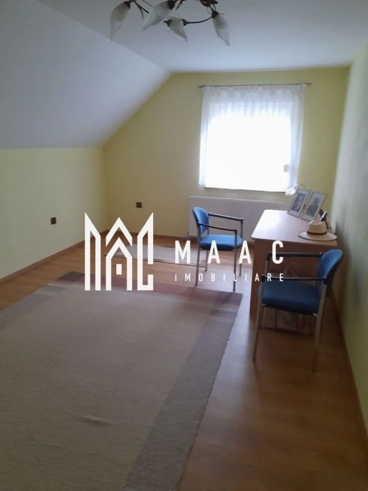 Casa individuala | 7 camere | Alma, Judetul Sibiu - MAAC Imobiliare vă propune spre vanzare o casa cu 7 camere, amplasată în comuna Alma, într-o zonă liniștită și plină de farmec. Construită în 2013, această proprietate este ideală pentru cei care caută un cămin confortabil, bine compartimentat. Cu regim de inaltime S+P+M, proprietatea are o pivnita racoroasa si un bar amenajat la subsol; la parter (115mp) gasim un garaj spatios, cu acces in casa, hol, living cu semineu, bucatarie moderna, dormitor si 2 bai (una mare, cu dus si cada, alta de serviciu); mansarda (90 mp)-3 dormitoare, hol, baie cu dus, balcon, acces la pod, terasa acoperita. In curte-anexă care include: bucătărie de vară, atelier, copertină pentru lemne. Dotari: curent trifazic, centrală termică pe gaz, semineu, panou solar pentru apă caldă menajeră, geamuri termopan cu rulouri, apă curentă și canalizare, conectate la rețeaua locală. Grădina generoasă, de 800 m², e amenajată cu pomi fructiferi și viță de vie. Fântână. Fie că te bucuri de grădina generoasă, de spațiile interioare bine gândite sau de liniștea zonei, acest loc te va face să te simți "acasă" încă de la prima vizită. Proprietatea se vinde complet mobilată. Pentru mai multe informații și pentru a programa o vizionare, ne poți contacta chiar acum! Nu uita să specifici ID-ul anunțului: CP2066511 }}