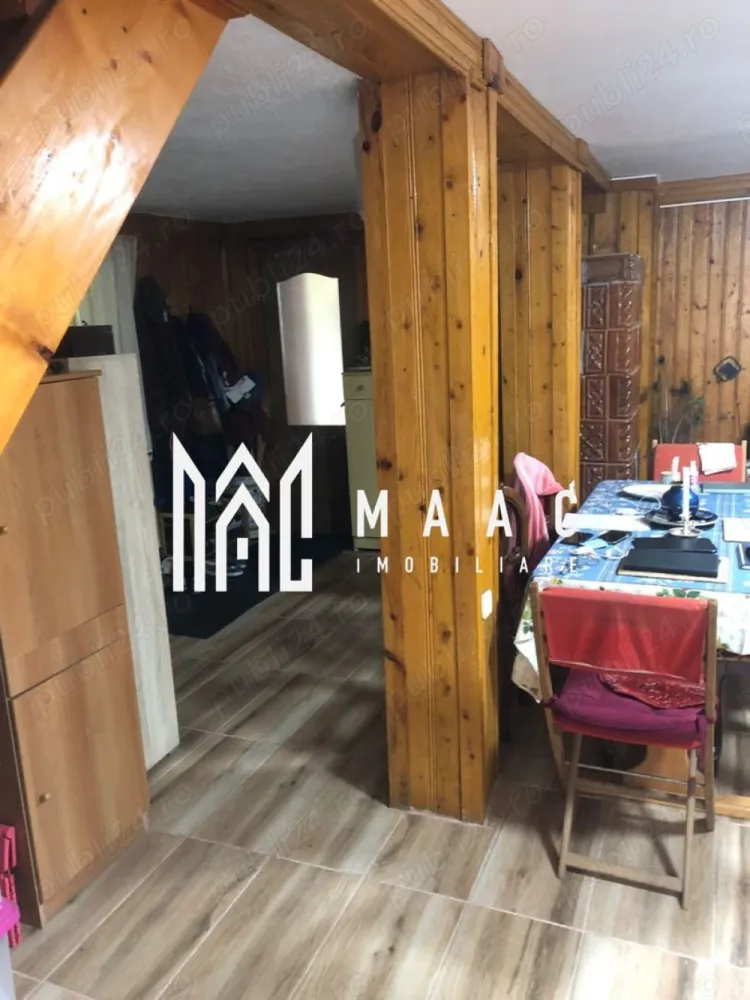 Casa cu 8 camere | 400 mp teren | Rășinari - MAAC Imobiliare vă propune spre vânzare o afacere la cheie în Valea Stezii, Rășinari – o proprietate ideală pentru activități turistice, compusă din două corpuri de clădiri și multiple facilități. Corpul Principal – Pensiune (P+M) Pensiunea este complet funcțională, oferind 5 dormitoare spațioase, un living generos, o bucătărie complet utilată și 3 grupuri sanitare. Dintre cele 5 dormitoare, 4 au balcoane, oferind o vedere minunată spre natură. Construcția are un parter din piatră, care nu necesită aer condiționat, și o mansardă din BCA și lemn. Încălzirea este asigurată de o centrală pe peleți. Acest corp necesită unele modernizări pentru a răspunde celor mai exigente standarde. Corpul Secundar – Casă (P+M) Cel de-al doilea corp de clădire, aflat în curtea proprietății: Parterul este compartimentat în două camere și un grup sanitar finalizate, iar mansarda este în stadiu „la roșu”., oferind posibilitatea de compartimentare în funcție de preferințele noului proprietar, necesită renovare pentru a fi adus la standarde moderne. Facilități și Anexe Grătar, cuptor și filigorie cu pivniță – ideale pentru momente de relaxare sau activități de catering pentru oaspeți. Curte spațioasă – acces auto și parcare pentru minimum 3 mașini. Detalii Tehnice Structura casei: parter din piatră și ciment; mansardă din BCA și lemn. Acoperișul este din tablă Bilka, oferind durabilitate și izolare termică. Proprietatea se vinde complet mobilată și utilată. Suprafața terenului: 400 mp Pentru mai multe detalii sau programarea unei vizionări, vă invităm să contactați echipa MAAC Imobiliare și să specificați ID-ul anunțului: CP2058622! }}
