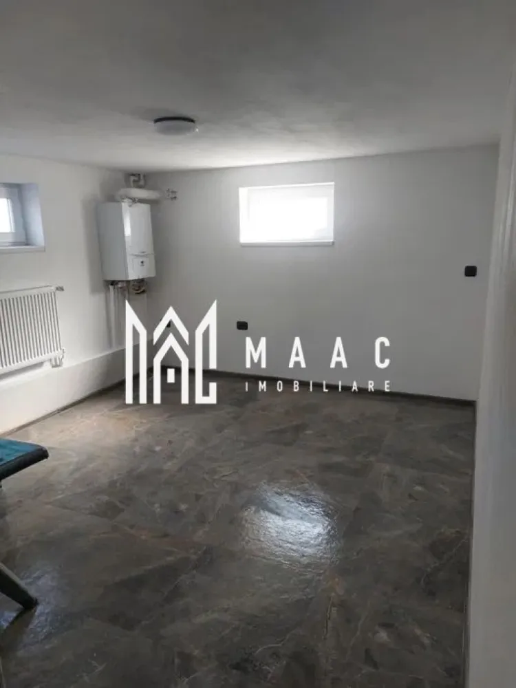 Casa 4 camere | D+P | Garaj | Curte | Pivnita | Selimbar - MAAC imobiliare va prezinta o casa situata in Selimbar formata din Demisol + Parter. Caracteristici generale: Suprafața utilă a casei: 160 mp Structură: Demisol + Parter Suprafața totală a terenului: 500 mp Amprenta casei: 180 mp Teren liber: 276 mp. Compartimentare: Demisol: Cameră tehnică: 17 mp Pivniță Garaj: 60 mp Parter: 3 camere: 18 mp fiecare Living: 30 mp Bucătărie: 15 mp 2 băi Exterior: Terasa: Situată în spatele casei, ideală pentru momente de relaxare și petrecere a timpului în aer liber Detalii suplimentare: Teren liber: 276 mp, oferind un spațiu generos pentru grădină, loc de joacă pentru copii sau alte amenajări exterioare. Avantaje și beneficii: Spațiu generos: Suprafața utilă de 160 mp și o compartimentare inteligentă asigură confort și funcționalitate pentru întreaga familie. Demisol util: Cameră tehnică, pivniță și garaj de 60 mp, oferind spații esențiale pentru depozitare și parcare. Zonă de zi: Livingul de 30 mp conectat cu bucătăria de 15 mp creează un spațiu deschis. Camere confortabile: Cele 3 camere de 18 mp fiecare oferă suficient spațiu pentru dormitoare, birouri sau camere pentru oaspeți. Băi: Două băi la parter, asigurând confort și comoditate. Teren liber: 276 mp de teren liber oferă multiple posibilități de amenajare exterioară. Pentru mai multe informații sau pentru a programa o vizionare, nu ezitați să ne contactați, specificand ID CP2058177 }}