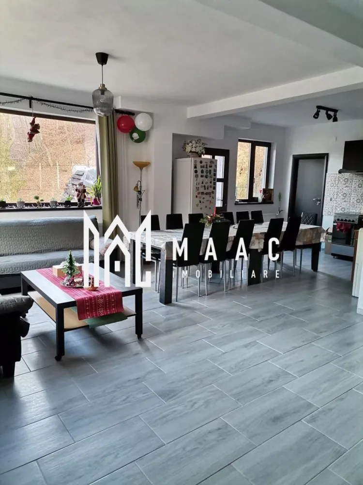 Casa individuala 8 camere | 575 mp teren I Porumbacu de Sus - Maac Imobiliare va propune spre vanzare o casa individuala situata in Porumbacu de Sus. Locuinta are 8 camere si regim de inaltime P+E+P. Casa este compartimentată astfel: parter-living spațios cu bucătărie open-space, 2 dormitoare cu băi proprii, cămară, baie, casa scarii, cameră tehnică; la etaj-3 dormitoare cu băi proprii, apartament (2 camere)cu baie proprie, dressing. Podul poate fi folosit ca spatiu de depozitare. Ca structura, s-a folosit beton armat (fier 12, 16) – beton B250, B300, izolație extrioară cu polistiren 10. Geamurile sunt termopane Salamander Tripan. Acoperisul- țiglă metalică Bilka 0,5 Gotic. Utilități: curent trifazic + generator trifazic 8.5kw, incalzire pe centrala de lemne si calorifere- Viadrus 35kW, puffer 1000l, boiler termic și electric 300, sursă apă proprie-puț forat, canalizarea- fosă ecologica 3000l În curte se află un foișor in suprafata de 21mp, dotat cu mobiler adecvat, o magazie de unelte și o zonă de relaxare cu leagăne. Casa se vinde complet mobilată și utilată. Se pretează perfect pentru afacere în turism datorită dotărilor complete de care dispune. Proprietatea este intabulată și certificată energetic cu clasa A. In apropiere sunt Castelul de Lut și Povestea Calendarului. Pentru mai multe detalii, vă rugăm să precizați ID-ul anunțului: CP2047027 }}