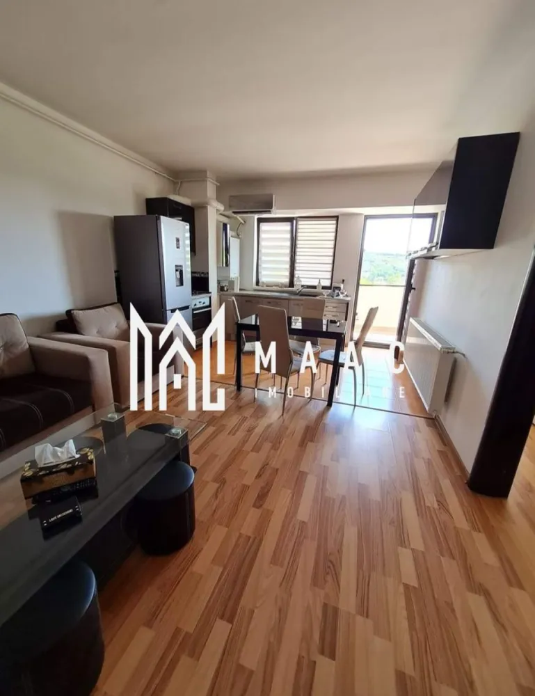 Apartament 3 camere | 70 MPU | - MAAC Imobiliare vă propune spre vânzare un apartament cu 3 camere, spațios și modern, ideal pentru o familie cu copii sau pentru investiție în vederea închirierii. Proprietatea este situată la etajul 4 al unui imobil prevăzut cu 2 lifturi și se remarcă prin suprafața generoasă de 70,08 mp, compartimentarea eficientă și confortul oferit de amenajarea completă. Apartamentul se vinde complet mobilat și utilat, fiind pregătit pentru mutare imediată, fără investiții suplimentare.

Locuința beneficiază de un living open-space generos de 31,45 mp, cu bucătărie integrată, două dormitoare confortabile și o baie spațioasă, oferind un spațiu optimizat pentru confortul zilnic. Balconul închis de 11,57 mp poate fi utilizat atât ca zonă de relaxare, cât și ca spațiu suplimentar de depozitare. În plus, apartamentul dispune de debara practică și hol de acces bine organizat, contribuind la o compartimentare funcțională și luminoasă.

Caracteristici:

Apartament cu 3 camere
Suprafață totală de 70,08 mp
Etaj 4
Bloc prevăzut cu 2 lifturi
Compartimentare practică și luminoasă
Se vinde mobilat și utilat la cheie
Ideal pentru locuit sau investiție

Compartimentare:
-Living open-space generos de 31,45 mp
-Două dormitoare confortabile
-Bucătărie integrată în zona de living
-Baie spațioasă
-Balcon închis de 11,57 mp
-Debara pentru extra spațiu de depozitare
-Hol de acces bine organizat

Dotări:
-Mobilier complet
-Electrocasnice incluse
-Finisaje moderne
-Balcon închis
-Spații generoase și bine iluminate natural
-Debara practică pentru depozitare suplimentară
-Imobil dotat cu două lifturi

Avantaje:
-Ideal pentru familii datorită suprafeței și compartimentării
-Potrivit pentru investiție și închiriere imediată
-Mutare fără investiții suplimentare
-Acces facil și confort sporit oferit de cele 2 lifturi
-Spațiu generos și bine optimizat
-Locuință pregătită complet pentru noii proprietari

Pentru mai multe detalii și stabilirea unei vizionări, vă rugăm să menționați la telefon numărul CP3079050.