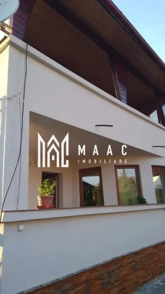 Casa 6 camere | P+2+Pod | 300 MPU | Curte | 680MP | Selimbar - MAAC Imobiliare va prezinta o casa individuala cu 6 camere, curte si gradina situata in zona Selimbar. Caracteristici: Parter: Două intrări separate, oferind acces și posibilitatea de a separa spațiile de locuit. Două terase generoase, perfecte pentru relaxare în aer liber și socializare. Living, ideal pentru petrecerea timpului liber. Bucătărie spațioasă și echipată. Un dormitor confortabil. Baie cu duș. WC de serviciu. Pivniță pentru depozitare suplimentară. Etajul 1: Trei dormitoare luminoase și spațioase, perfecte pentru odihnă și relaxare. Baie cu cada. Două terase private, oferind vederi pitorești. Etajul 2: Două dormitoare, potrivite pentru membrii familiei sau oaspeții care vizitează. Baie cu duș, asigurând confort și comoditate. Living luminos. Birou, oferind un spațiu dedicat pentru lucru sau studiu. Exterior: Curte: Două intrări separate, pentru acces facil. Zonă pavată, ușor de întreținut și ideală pentru petrecerea timpului în aer liber. Zonă de grătar. Filigorie, oferind umbră plăcută în zilele călduroase de vară. Grădină îngrijită de 300mp, cu potențial pentru amenajare și spațiu verde. Parcare: Spațiu de parcare generos în curte, potrivit pentru șase sau șapte mașini. Alte informații: Suprafața totală a curții: 680 mp, oferind spațiu generos pentru activități în aer liber. Curte liberă: 550 mp. Amprenta casei: 110 mp. Anul construcției: 2007. Există o filigorie în curte, oferind un spațiu relaxant și plăcut în aer liber. Pentru mai multe detalii precizati telefonic ca ati vazut anuntul cu ID: CP2021659 }}