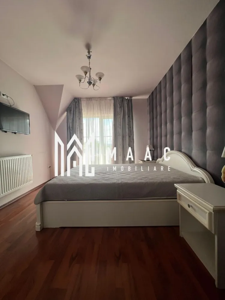 Vila | Ramnicu Valcea | Lenin Sud | De inchiriat - MAAC Imobiliare vă propune spre închiriere o vilă modernă D+P+1, situată în cartierul Lenin Sud din Râmnicu Vâlcea, într-o zonă liniștită, cu vedere panoramică deosebită și acces facil către principalele puncte de interes ale orașului.

Proprietatea are o suprafață utilă de 150 mp și este complet mobilată și utilată, fiind pregătită pentru mutare imediată. Compartimentarea este realizată inteligent pentru a oferi confort și funcționalitate, vila dispunând de un living spațios și luminos, bucătărie complet echipată, două dormitoare primitoare, cameră de dressing și două grupuri sanitare.

Unul dintre punctele forte ale proprietății este terasa generoasă închisă cu sticlă, un spațiu versatil ce poate fi utilizat pe tot parcursul anului, ideal pentru relaxare, socializare sau zonă de dining cu priveliște panoramică.

Locuința beneficiază de centrală termică proprie pe gaz, asigurând confort termic și eficiență pe tot parcursul anului.

În plus, imobilul dispune de garaj subteran, oferind siguranță și confort pentru autoturism.

Această proprietate reprezintă alegerea ideală pentru persoanele care își doresc liniște, spațiu și un ambient modern într-una dintre cele mai apreciate zone rezidențiale din Râmnicu Vâlcea.

Pentru mai multe detalii și programarea unei vizionări, echipa MAAC Imobiliare vă stă la dispoziție.

ID: CP3080060