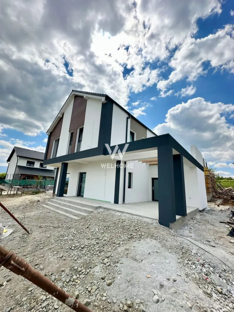 Casă single modernă, eficientă energetic și curte generoasă