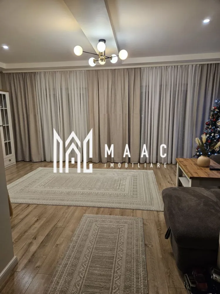 Casa Individuala I 5 Camere I 550 mp Curte I Cisnadie - Se oferă spre vânzare o casă spațioasă, cu suprafață utilă de 160 mp, situată în Cisnădie, într-o zonă liniștită, ideală pentru locuire permanentă. Proprietatea beneficiază de un teren liber de 550 mp, oferind spațiu generos pentru curte, grădină sau zone de relaxare. Compartimentare: 5 camere, dintre care 4 dormitoare și 1 living spațios 2 băi, modern amenajate 1 bucătărie 3 terase, ideale pentru relaxare Pivniță și spații de depozitare Detalii suplimentare: Suprafață utilă: 163 mp Teren liber: 550 mp Imobilul se predă la cheie la interior, fiind complet mobilat și utilat Exteriorul este la roșu, oferind posibilitatea de personalizare conform preferințelor Construcție solidă, cu potențial ridicat Această proprietate este ideală pentru o familie care își dorește spațiu, liniște și posibilitatea de a-și amenaja exteriorul după propriul gust, într-o zonă bine poziționată din Cisnădie. Pentru informati si vizionari: ID: CP2861326 }}