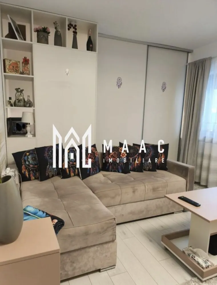 Apartament 2 Camere | Curte | Doamna Stanca - MAAC Imobiliare oferă spre vânzare un apartament cu orientare sud-vestică, având o suprafață utilă de 52 mp, construit în 2021, încadrat în clasa energetică A. Proprietatea beneficiază de balcon, debară, loc de parcare și o curte privată de 45 mp, ideală pentru relaxare sau activități în aer liber. Compartimentare și avantaje: • Bucătărie separată, complet mobilată și utilată cu toate electrocasnicele necesare unei gospodării moderne • Living cu acces direct către balcon și curte • Ieșire în balcon și curte atât din bucătărie, cât și din living • Baie spațioasă, dotată cu geam • Centrală termică proprie • Încălzire în pardoseală Pentru mai multe detalii sau pentru programarea unei vizionări, vă rugăm să ne contactați, menționați ID-ul anunțului: CP2863559. }}