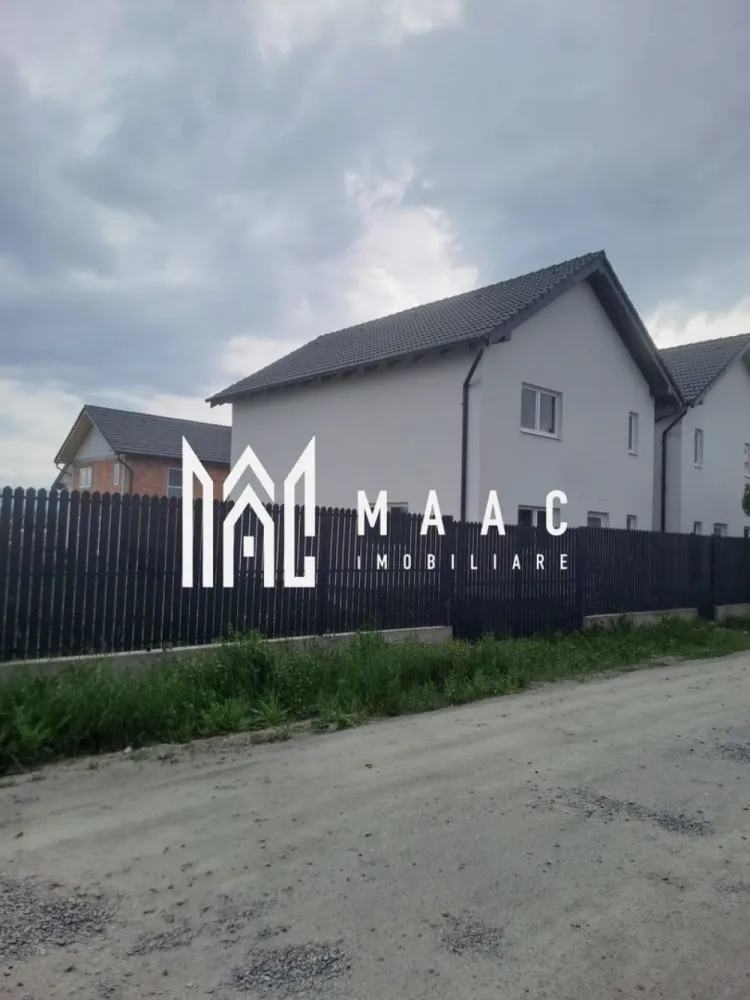 Casă Individuala | 4 camere | 123MPU | Șura Mică - MAAC Imobiliare vă propune spre vânzare o casă modernă, spațioasă și excelent compartimentată, situată într-o zonă rezidențială liniștită și cautată: cartierul Eden din Șura Mică.

Această proprietate reprezintă alegerea ideală pentru o familie care își dorește confortul unei locuințe individuale, beneficiind de o curte generoasă.

Casa este desfășurată pe două niveluri (Parter + Etaj) având o suprafață construită la sol de 77mp pe nivel (suprafața construită desfașurată totală de 154mp) și o suprafață utilă totală de 123 mp. 

Proprietatea dispune de un teren cu o curte liberă amenajabilă

Caracteristici principale:
4 camere luminoase si spațioase
Predare la alb
Bucatarie: Deschisa (open-space), integrată în zona de zi
Ferestre: Profil PVC cu geamuri termopan pentru o izolație termică și fonică optimă
Finisaje deosebite: Pereți cu inserții de piatra naturala, ce ofera un caracter elegant si modern locuinței

Compartimentarea se face astfel:
 Parter 
Living generos de 37.44 mp, ideal pentru petrecerea timpului cu familia, cu spațiu dedicat pentru dining
Birou , pretabil pentru spațiu de lucru de acasă, bibliotecă sau dormitor de oaspeți
Grup sanitar
Înalțimea încăperilor este de 2.80 m, oferind o senzație deosebită de spațiu
 Etaj (Suprafata Utila: 60.76 mp + Balcon)
Dormitor 1 suprafață de 18.90 mp, cu acces direct pe balcon
Dormitor 2 suprafață de 14.94 mp, cu acces direct pe balcon
Dormitor 3 suprafață de 12.00 mp, ideal pentru copii
Baie principală spațioasă de 8.45 mp, prevazută cu spațiu pentru cadă
Hol 
Balcon de 4.24 mp

Proprietatea se predă la alb, fiind o oportunitate excelentă într-un cartier rezidențial curat, aerisit și ferit de agitația orașului, dar cu acces rapid către Sibiu.

Pentru programarea unei vizionări sau pentru mai multe detalii suplimentare, contactați-ne și specificați codul de identificare al proprietății ID: CP3100534