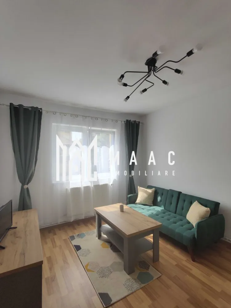 Apartament 2 camere | Renovat | Modern | Mihai Viteazu - MAAC Imobiliare ofera spre inchiriere apartament cu 2 camere, complet mobilat si utilat, in zona Mihai Viteazu - Hotel Plaza. Locuinta a fost recent renovata, se afla la etajul 4/5, are suprafata utila de 40mp si este alcatuita din living luminos cu Smart TV, dormitor cu pat dublu, bucatarie inchisa cu toate facilitatile, si baie moderna cu geam si cada. De asemenea, apartamentul este dotat cu internet. Amplasamentul blocului este unul avantajos, aflandu-se la 15-20 minute de mers pe jos de centru, la 5 minute de parcul SubArini magazine, farmacii, cafenele, sala de sport. Se percepe o chirie in avans si garantie in cuantumul unei chirii lunare. Se inchiriaza pe o perioada de minim 12 luni. Pentru mai multe detalii, va rugam specificati telefonic: CP2873856 }}