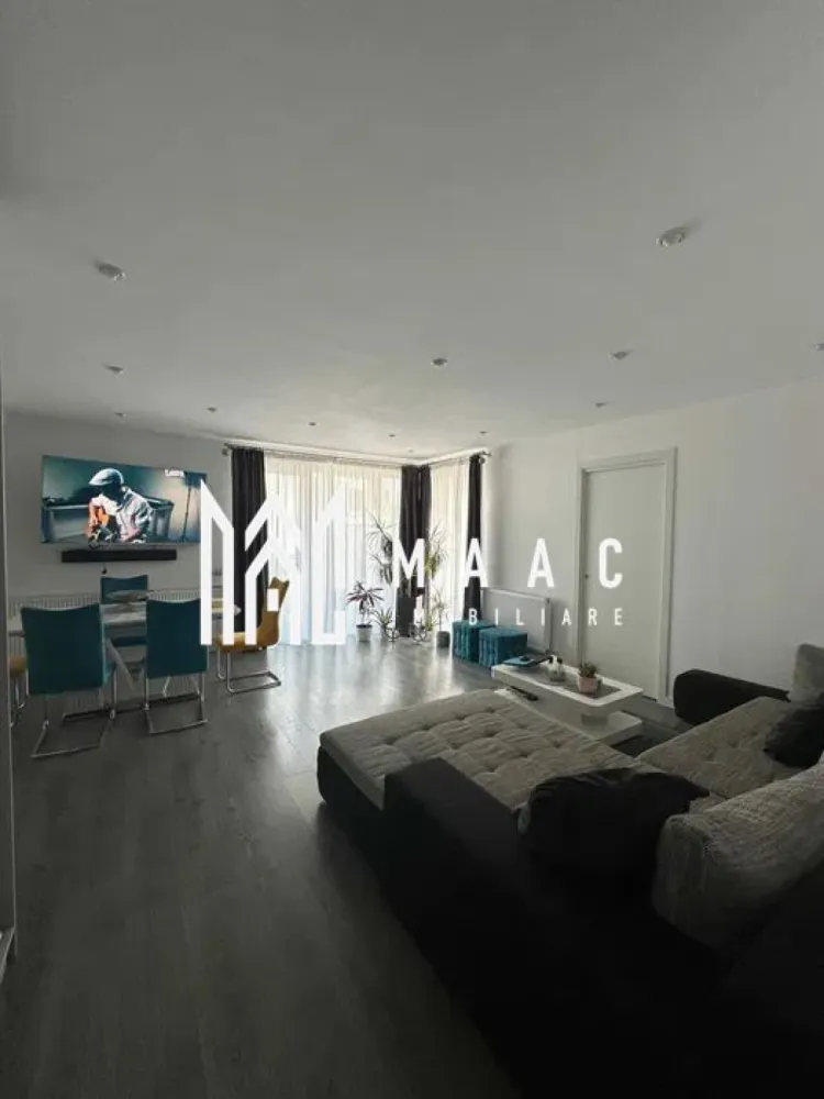 Apartament 3 camere | Mobilat | Gradina | Parcare | Selimbar - MAAC Imobiliare vă prezintă spre vânzare un apartament de 3 camere cu gradina, situat în Șelimbăr, într-o zonă rezidențială apreciată. Caracteristici: Apartament amplasat într-un imobil construit în anul 2016. Un singur apartament pe nivel. Bloc cu doar 4 apartamente. Parter înalt, la aproximativ 1 metru de sol. Suprafețe și spații exterioare: Suprafață utilă de 83 mp. Terasă cu suprafața de 17 mp. Grădină privată de 33 mp, cu acces direct. Două locuri de parcare înscrise în acte, cu suprafața totală de 25 mp. Posibilitate de parcare pentru o a treia mașină în spatele locurilor existente. Locuri de parcare suplimentare pentru vizitatori. Compartimentare: Living generos și primitor, cu spațiu de cămară. Bucătărie complet mobilată și utilată. Două dormitoare complet mobilate, fiecare cu suprafața de aproximativ 14 mp. Dressinguri realizate la comandă, inclusiv un dressing de mari dimensiuni, de aproximativ 4 m x 2,5 m. Baie complet echipată. Orientare și acces: Orientare sud pentru living, bucătărie și terasă, oferind lumină naturală pe tot parcursul zilei. Orientare nord pentru dormitoare și zona de parcare. Trei accesuri către terasă, din living, bucătărie și grădină. Acces în grădină și din zona de parcare. Construcție și izolații: Uși interioare Porta Doors. Ferestre cu trei foi de sticla. Placă între etaje de 20 cm. Ziduri interioare de 20 cm și ziduri exterioare de 30 cm. Dotări și electrocasnice: Electrocasnice Bosch, inclusiv mașină de spălat vase, cuptor și plită. Frigider Liebherr. Televizor Sony Bravia cu diagonală de 165 cm. Mașină de spălat rufe și uscător încorporate. Predare: Apartamentul se vinde complet mobilat și utilat, fiind pregătit pentru mutare imediată, fără necesitatea unor investiții suplimentare. Pentru mai multe detalii precizati telefonic ca ati vazut anuntul cu ID: CP2876942 }}