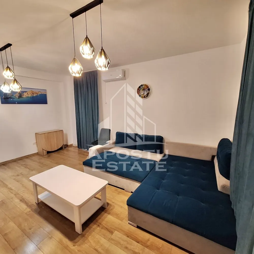 Apartament cu 2 camere mobilat cu gradina proprie de 50 mp in Giroc. - APOSTU ESTATE va propune spre vanzare un apartament cu 2 camere situat in Giroc la asfalt.
Drumul de acces spre imobil este asfaltat. In apropiere sunt magazine si supermarket-uri precum Lidl, Profi, Mega Image, Penny, Scoala, gradinita și parc la o distanta de 3-5 minute, acces facil la mijloace de transport in comun.

Apartamentul se vinde complet mobilat si utilat, precum se observa in imagini.

Imobilul are o suprafata de 56 mp utili, este situat la parter si dispune de 2 terase de pe care se face accesul in gradina.

Compartimentare:
- hol acces.
- bucatarie inchisa.
- dormitor.
- living.
- baie cu geam si cada.
- 2 terase.
- gradina proprie de 50 mp. 

Detalii tehnice:
- constructie realizata in anul 2023 din caramida Porotherm de 25 cm.
- exterior izolat cu polistiren de 10 cm eps 80.
- pereti despartitori complet din caramida (fara rigips) tencuiti mecanizat finisati cu glet si vopsea lavabila.
- geamuri termopan cu 3 sticle pentru izolare fonica si termica superioara, foarte mari si luminoase dotate cu rulori.
- centrala proprie pe gaz, sistem eficient de incalzire prin pardoseala.
- aparataje modulare Gewis.
- usa acces securizata, usi interioare Porta Doors.
- electrocasnice noi, in stare perfecta de functionare. (frigider, masina de spalat rufe, masina de spalat vase, aragaz, cuptor, hota)
- mobilier de calitate inalta, realizat pe comanda pe toata suprafata apartamentului.
- 1 loc de parcare in cf.
Utilitati complete: curent, apa de la retea, canalizare, gaz.

Pentru mai multe detalii nu ezitati sa ne contactati!

Acceptam orice fel de credit bancar. Oferim consultanta si solutii financiare prin colaboratorii nostri pentru a obtine cel mai avantajos credit Ipotecar sau Noua Casa.

Va asteptam cu drag la o vizionare chiar astazi!
CP2782745