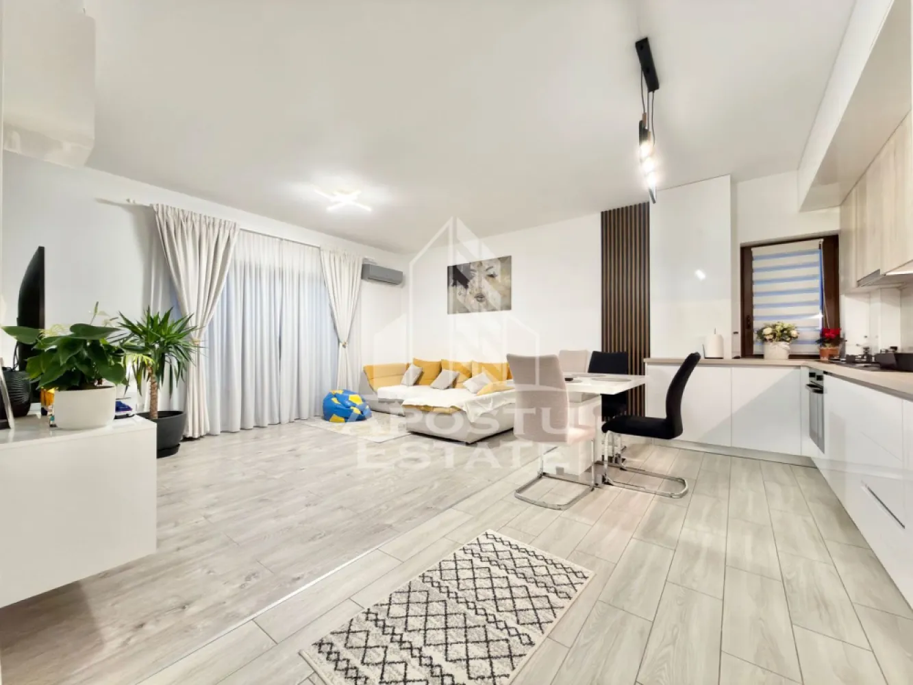 Apartament cu 3 camere mobilat, 70 mp utili, in Giroc la etajul 2. - APOSTU ESTATE va propune spre vanzare un apartament cu 3 camere situat in Giroc.
Drumul de acces spre imobil este pietruit. In apropiere sunt magazine si supermarket-uri precum: Profi, Lidl, Penny, magazin alimentar, scoala si gradinita la o distanta de 10 minute, acces facil la mijloace de transport in comun.

Apartamentul se vinde complet mobilat si utilat precum se observa in imagini. 
Imobilul este situat la etajul 2.
Suprafata este de 70 mp utili + terasa de 8 mp.

Compartimentare:
- hol acces.
- living si bucatarie open space.
- 2 dormitoare.
- baie cu geam si dus.
- terasa de 8 mp.

Detalii tehnice:
- constructie realizata in anul 2019 din caramida Porotherm de 25 cm.
- exterior izolat cu polistiren de 10 cm eps 80. 
- pereti despartitori complet din caramida (fara rigips) tencuiti mecanizat finisati cu glet si vopsea lavabila.
- mobilier modern, de calitate inalta realizat pe comanda pe toata suprafata apartamentului.
- electrocasnice noi, in stare perfecta de functionare: (plita electrica, cuptor, masina de spalat vase, masina de spalat rufe, masina de uscat rufe, clima).
- geamuri termopan cu 3 sticle pentru izolare fonica si termica superioara, foarte mari si luminoase.
- aparat pentru aer conditionat in living.
- centrala proprie pe gaz, sistem eficient de incalzire prin pardoseala.
- aparataje modulare Gewis.
- usa acces securizata, usi interioare porta doors albe.
- 2 locuri de parcare in cf.

Utilitati complete: curent, apa de la retea, canalizare, gaz, internet prin fibra optica, cablu Tv.
Pretul este negociabil.
Pentru mai multe detalii nu ezitati sa ne contactati!

Acceptam orice fel de credit bancar. Oferim consultanta si solutii financiare prin colaboratorii nostri pentru a obtine cel mai avantajos credit Ipotecar sau Noua Casa.

Va asteptam cu drag la o vizionare chiar astazi!
CP2976594