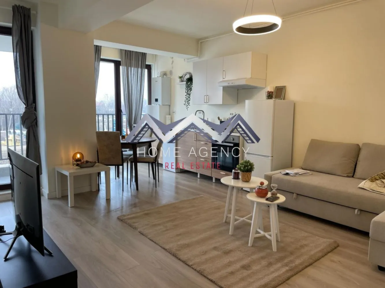 Apartament 2 camere - Et 1 - Lift - Parcare subterana - Otopeni central - Vă invităm să descoperiți o proprietate superbă, spre vanzare, disponibilă imediat: un apartament de 2 camere cu încălzire în pardoseală foarte cochet, utilat și mobilat complet, situat la etajul 1/3, într-un bloc nou (cu lift) din Otopeni.

Apartamentul este foarte luminos, foarte spațios și foarte bine compartimentat, având un living, o bucătărie deschisă, un dormitor, o baie și un balcon.

De la primii pași în această proprietate găsim un loc care oferă confort și liniște. Apartamentul se predă COMPLET utilat și mobilat, inclusiv: cuptor cu microunde, aparat de cafea, mașină de spălat rufe, mașină de spălat vase, bideu, A/C etc. 

Apartamentul beneficiază de parcare subterană cu barieră, supraveghere video și acces facil către centrul orașului, la doar 5 minute de mers pe jos față de Primăria Otopeni.

Proiectul este destinat celor care sunt în căutarea mix-ului perfect între standarde de calitate superioară, funcționalitate, confort și intimitate, într-o zona liniștită a orașului Otopeni.

Programează-te acum pentru o vizionare!

Dacă aveți o proprietate de vânzare/închiriere sau sunteți interesați de o proprietate aflată în portofoliul agenției noastre, vă rugăm să ne contactați la numărul de telefon din anunț sau pe adresa de email contact@homeagency.ro.