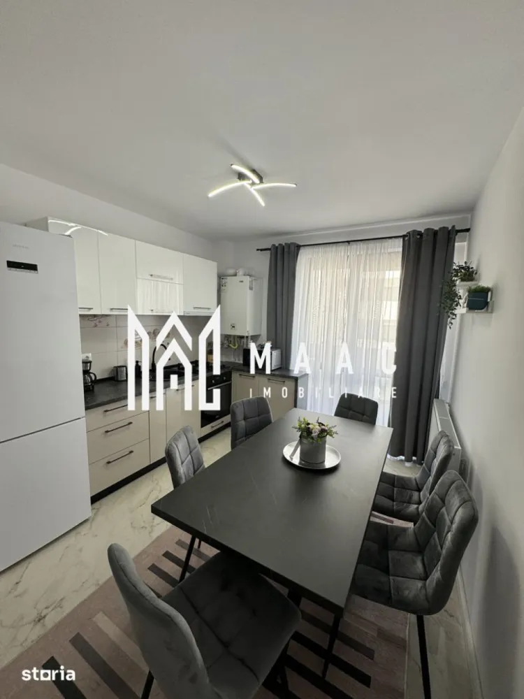 Apartament 2 Camere | Decomandat | Terasă 12 MP | Doamna Stanca - MAAC Imobiliare vă propune spre vânzare un apartament modern cu 2 camere decomandate, situat într-un imobil nou cu lift, în zona Doamna Stanca.

Caracteristici principale

• suprafață utilă de 54 mp
• terasă generoasă de 12 mp
• etaj 5 din 7, cu lift
• compartimentare decomandată
• loc de parcare privat inclus în acte

Compartimentare și spații interioare

• living spațios și luminos
• dormitor confortabil
• bucătărie separată cu zonă de dining
• baie modernă
• terasă cu acces atât din living, cât și din bucătărie

Dotări și finisaje

• apartament complet mobilat și utilat
• aer condiționat
• centrală termică prin condensare
• mobilier realizat la comandă
• uși Porta Doors
• colțar extensibil și pat cu spațiu de depozitare
• electrocasnice incluse: mașină de spălat, frigider, plită, cuptor, TV

Localizare și avantaje

• amplasat pe strada Doamna Stanca
• vizavi de Shopping City Sibiu
• acces rapid către supermarketuri, farmacii și clinici medicale
• stații de transport în comun în apropiere
• zonă modernă, foarte bine conectată

 Pentru mai multe detalii sau pentru programarea unei vizionări, vă rugăm să ne contactați și să menționați ID-ul proprietății: CP3116927.