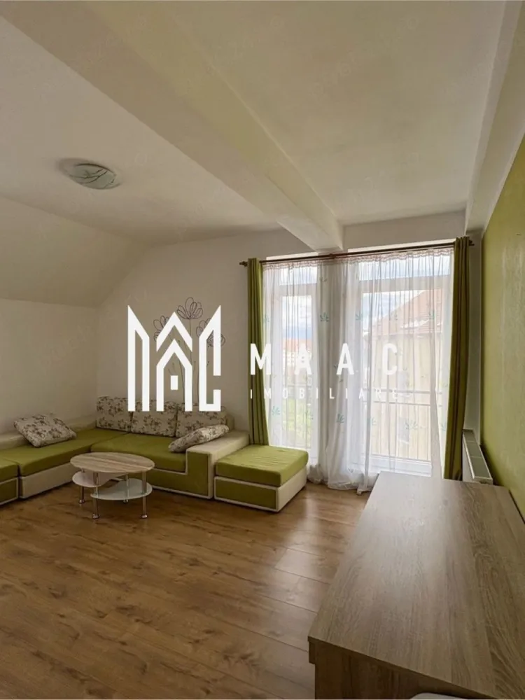 Apartament 2 camere | 54 mp | Alma Turnisor - MAAC Imobiliare vă propune spre inchiriere un apartament cu 2 camere, complet decomandat, situat la mansarda înaltă a unui imobil construit din proiect cu acest nivel, fără compromisuri privind spațiul util.

Locuința dispune de o suprafață utilă de 54 mp, calculată exclusiv pentru spațiul interior locuibil, fără balcoane sau alte dependințe incluse artificial în suprafață.

Compartimentarea este eficientă și funcțională, accesul realizându-se dintr-un hol generos către toate încăperile. Apartamentul beneficiază de bucătărie separată, două camere luminoase, baie și spații bine organizate.

Poziționarea la mansarda înaltă oferă un confort sporit, porțiunile teșite începând de la o înălțime considerabilă, astfel încât nu afectează suprafața utilă sau funcționalitatea încăperilor.

Un avantaj important îl reprezintă faptul că toate încăperile, inclusiv bucătăria și baia, beneficiază de lumină naturală și ventilație directă, prin intermediul ferestrelor.

Apartamentul se vinde mobilat și utilat, fiind dotat cu:

centrală termică proprie;
frigider;
aragaz;
cuptor cu microunde;
mașină de spălat rufe.

Pentru mai multe detalii și vizionări, precizati telefonic ca ati vazut anuntul cu ID: CP3129818