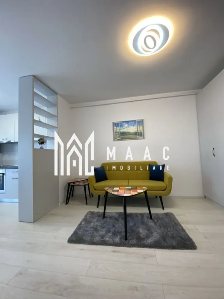 Apartament 2 camere | 46 MPU | Magnolia - MAAC Imobiliare vă propune spre închiriere un apartament modern cu 2 camere, situat la etajul 8 al unui imobil nou prevăzut cu lift, amplasat în zona Magnolia din Sibiu – o locație apreciată pentru liniște, accesibilitate și dezvoltarea continuă a cartierului. Proprietatea este ideală pentru un cuplu, o persoană activă sau o familie la început de drum, oferind confort, funcționalitate și un ambient plăcut.

Apartamentul are o suprafață utilă de 48 mp și beneficiază de un balcon generos de 7 mp, perfect pentru relaxare. Locuința este complet mobilată și utilată, amenajată cu bun gust și pregătită pentru mutare imediată.

Compartimentare:
-living luminos și primitor
-dormitor confortabil
-bucătărie practică și complet utilată
-baie
-hol
-balcon spațios de 7 mp

Dotări și avantaje:
-bloc nou, bine întreținut
-etaj 8 cu lift
-apartament izolat termic
-complet mobilat și utilat
-mașină de spălat rufe
-mașină de spălat vase
-finisaje moderne și aspect îngrijit
-zonă liniștită și bine conectată
-acces facil către magazine, mijloace de transport și puncte de interes

Localizare:
Sibiu, zona Magnolia – cartier modern, apreciat pentru confort și acces rapid către oraș

Condiții de închiriere:
-garanție: echivalentul unei chirii lunare
-disponibilitate: 1 Iunie

Pentru mai multe detalii sau pentru programarea unei vizionări, vă rugăm să ne contactați specificând ID: CP3117618