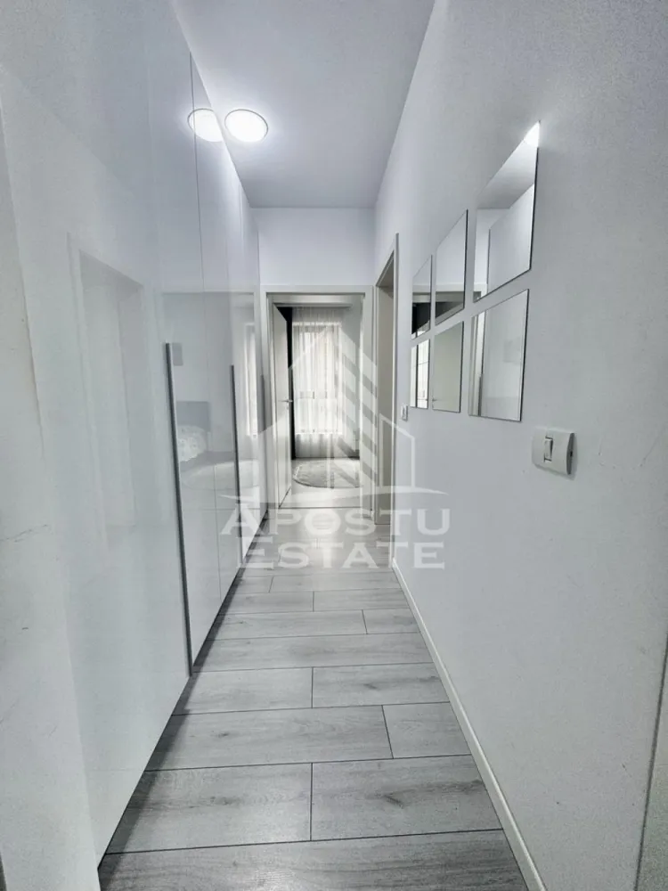 Apartament cu 2 camere la etajul 1 cu lift complet mobilat si utilat - APOSTU ESTATE va propune spre inchiriere un apartament cu 2 camere spatios si luminos, situat in Giroc, potrivit pentru cupluri sau persoane singure care isi doresc o locuinta in care sa se simta confortabil.

Imobilul este situat la etajul 1 din 3, intr-un bloc cu lift si are suprafata de 52 mp.

Compartimentare:
- hol acces cu numeroase spatii pentru depozitare
- Bucatarie complet mobilata si utilata (frigider si masina de spalat vase incorporate, plita pe gaz, cuptor electric, hota si cuptor cu microunde)
- Living luminos si spatios
- Dormitor complet mobilat si utilat
- Baie cu cada si geam
- Terasa 

Confortul termic este asigurat prin intermediul centralei proprii pe gaz, incalzire cu calorifere si al aparatului pentru aer conditionat montat in living.
1 Loc de parcare supravegheat video.

In zona sunt magazine si supermarket-uri precum Profi la 1 minut de mers pe jos, statie de autobuz la 3 minute, scoala si gradinita la 15 minute distanta.

Pentru mai multe detalii nu ezitati sa ne contactati!
Va asteptam cu drag la o vizionare chiar astazi!
CP2741330