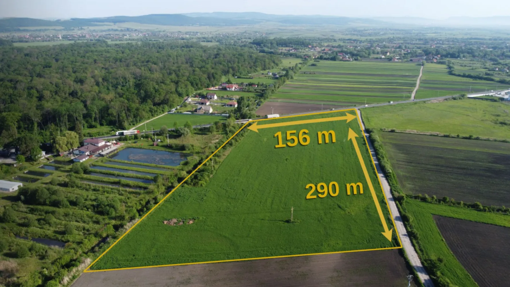Industrial Land for Sale ROMANIA - BRASOV | 45,000 sqm - 45,000 sqm PUZ Approved Industrial Land near Brașov, Romania
Exceptional investment opportunity in one of Brașov's most promising industrial and logistics corridors.

Located in Prejmer – Lunca Câlnicului, this 45,000 sqm intravilan land parcel benefits from direct access to DN11 and excellent connectivity to Brașov, regional transport routes, and Brașov-Ghimbav International Airport.
Key Property Highlights
Land Area: 45,000 sqm
Intravilan Land
PUZ Approved
Designated for Logistics, Warehousing, Offices & Light Industrial Development
POT: 35%
CUT: 0.6
Maximum Building Height: 12 m ridge / 10 m cornice
Direct DN11 Frontage
Dual Road Access
Land Book Extract Available
No Encumbrances
Urbanism Certificate Issued
Strategic Location
8 minutes to Brașov City Entry
Approximately 12 minutes to Brașov City Centre
Approximately 17 minutes to Brașov-Ghimbav International Airport
Excellent access to regional and national transportation networks
Ideal For
Logistics & Distribution Centers
Warehousing Facilities
Light Manufacturing
Business & Office Parks
Commercial Service Facilities
Long-Term Industrial Investment Projects

The property offers a rare combination of approved planning documentation, strategic road access, and proximity to one of Romania's fastest-growing regional economies.
Investment Opportunity
With approved urban planning parameters and a flexible development profile, the site is well suited for both owner-occupiers and institutional investors seeking industrial or logistics development opportunities in the Brașov metropolitan area.
Disclaimer

All development visualizations, logistics park concepts, masterplans and renderings presented in the marketing materials are illustrative only and are intended to demonstrate potential development scenarios. Any future development remains subject to detailed design, permitting procedures, technical studies and applicable urban planning regulations.