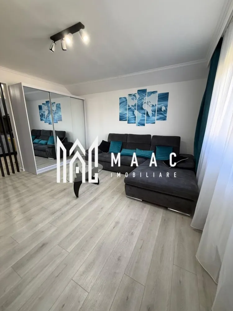 Apartament 2 Camere I 61 MPU I Etaj 3 I Selimbar - Maac Imobiliare vă propune spre vânzare un apartament deosebit, complet renovat în anul 2026, situat în Șelimbăr, într-o zonă exclusiv de case, liniștită și apreciată pentru confortul și intimitatea oferite.

Locuința are o suprafață utilă de 61 mp și este compartimentată decomandat (circular), oferind un spațiu bine organizat și funcțional .
Apartamentul este compus din:

Hol de acces
Bucătărie spațioasă cu zonă de dining
Living luminos
Dormitor generos
Baie
Balcon închis, cu o priveliște spectaculoasă către Munții Făgăraș

Un mare avantaj al proprietății îl reprezintă podul generos de aproximativ 40 mp, prevăzut cu fereastră Velux, dublu podit și parchetat. Acesta poate fi utilizat atât ca spațiu de depozitare, cât și ca loc de joacă pentru copii, birou, hobby room sau chiar spațiu multifuncțional adaptat nevoilor viitorilor proprietari.

Apartamentul beneficiază de finisaje moderne și a fost renovat integral, fiind pregătit pentru mutare imediată, fără investiții suplimentare.Ideal pentru locuit sau investiție
Pentru informati si vizionari: CP3149138