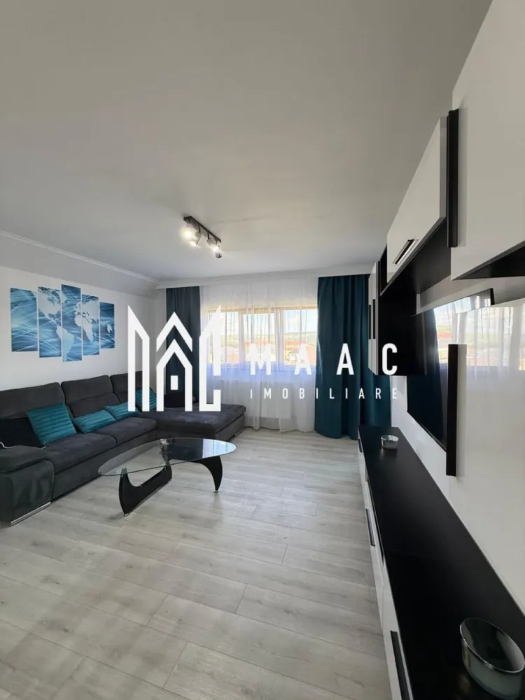 Apartament 2 Camere I 61 MPU I Etaj 3 I Selimbar - Maac Imobiliare vă propune spre vânzare un apartament deosebit, complet renovat în anul 2026, situat în Șelimbăr, într-o zonă exclusiv de case, liniștită și apreciată pentru confortul și intimitatea oferite.

Locuința are o suprafață utilă de 61 mp și este compartimentată decomandat (circular), oferind un spațiu bine organizat și funcțional .
Apartamentul este compus din:

Hol de acces
Bucătărie spațioasă cu zonă de dining
Living luminos
Dormitor generos
Baie
Balcon închis, cu o priveliște spectaculoasă către Munții Făgăraș

Un mare avantaj al proprietății îl reprezintă podul generos de aproximativ 40 mp, prevăzut cu fereastră Velux, dublu podit și parchetat. Acesta poate fi utilizat atât ca spațiu de depozitare, cât și ca loc de joacă pentru copii, birou, hobby room sau chiar spațiu multifuncțional adaptat nevoilor viitorilor proprietari.

Apartamentul beneficiază de finisaje moderne și a fost renovat integral, fiind pregătit pentru mutare imediată, fără investiții suplimentare.Ideal pentru locuit sau investiție
Pentru informati si vizionari: CP3149138