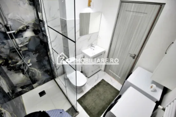 Apartament 1 camera in bloc NOU,46 mp,1 parcare privată