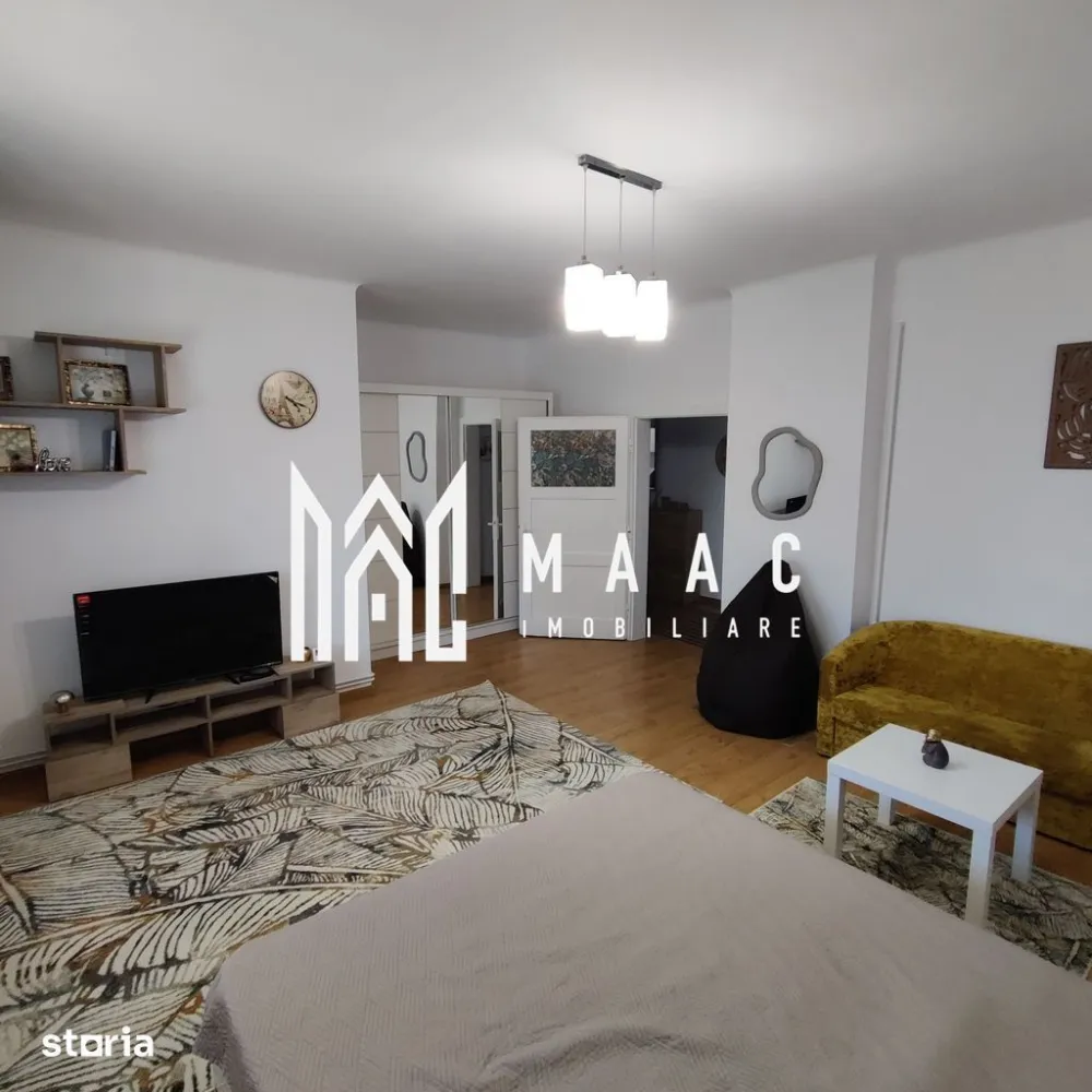 Apartament 1 camera | Etaj 1 | Decomandat | Terasa | Curte - MAAC Imobiliare vă propune spre vanzare un apartament cu o cameră, decomandat, situat la etajul 1 unei case din zona centrală (10 minute de mers pe jos de centru), mai exact pe Strada Constantin Noica.

Locuinta cuprinde: hol de acces, cameră spațioasă, bucătărie cu cămară, baie cu geam.

Garsoniera este recent renovata si mobilata, avand o suprafata toatala de 51,14 mp utili.

Aceasta este repartizata astfel: hol de 11.09 mp, camera de 23.12 mp, bucatarie de 11.27 mp, camara de 1.16 mp, baie de 4.5 mp si un balcon-terasa de 23.4 mp.

Garsoniera se afla intr-un imobil cu etaj, fiind situata la etaj unde se mai afla inca 4 familii, avand o curte comuna de 1623 mp unde se poate parca o masina (cota parte de 280mp)

Garsoniera dispune de centrala noua prin condensare, aragaz, cuptor cu microunde, cafetiera, mobila noua, TV nou, masina de spalat fiindca foarte bine pozitionata atat raportata la Facultatea de Medicina cat si in apropiere de centru ( 2 minute de mers pe jos pana in Piata Mare-Sibiu ).

Instalația electrică este refăcută integral, instalația sanitară la fel, geamurile sunt de termopan iar pereții beneficiază de izolație de 10 cm

Acoperișul este schimbat complet de 5 ani.În pod se beneficiază de spațiul conform amprentei apartamentului, având posibilitatea de mansardare.

Designul modern si ambientul placut imprima locatiei o energie pozitiva si un aer calm, intim.

În imediata apropiere se află centre comerciale, instituții de învățământ, bancare, mijloace de transport în comun.

In imobil se poate muta imediat sau se poate transforma în regim hotelier, având potențial maxim datorită poziționării centrale cât și a curții disponibile.

Pentru mai multe detalii, precizați telefonic că ați văzut anunțul cu ID: CP3117932.