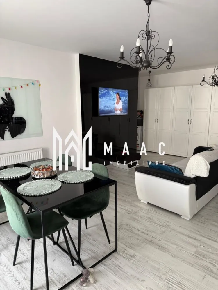 Apartament 3 camere | Sibiu Central | 64 mp, ultrafinisat - Apartament cu 3 camere, ultrafinisat, în zona Central din Sibiu, pe Calea Gusteriței, la etajul 3 din 4, cu 64 mp utili, terasă și două balcoane. O locuință modernă, luminoasă și bine organizată, pregătită pentru mutare imediată.

Detalii proprietate:
• Suprafață utilă: 64 mp
• Compartimentare: 3 camere, 2 băi, 1 bucătărie
• Etaj: 3 din 4
• An construcție: 2020
• Confort: Lux
• Stare interioară: ultrafinisat
• 1 loc de parcare
• 2 balcoane și o terasă de 12 mp
• Imobil cu lift
• Mobilat complet

Context și amplasare:
Proprietatea este situată în Sibiu, pe Calea Gusteriței, în zona Central, într-un imobil modern finalizat în 2020. Accesul este facil către punctele de interes din oraș, iar configurația apartamentului oferă spațiu util și funcționalitate pentru locuire de zi cu zi.

Pentru mai multe detalii sau pentru programarea unei vizionări, vă stăm cu drag la dispoziție. Cod anunț CP3173575. Contactați-ne pentru o vizionare și pentru informații suplimentare.