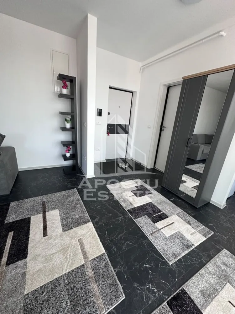 Apartament 1 camere de inchiriat,Dumbravita, Timisoara - Agentia imobiliara APOSTU ESTATE va propune spre inchiriere un apartament cu 1 camere, spatios si luminos, situat in zona Aradului, o zona linistita si bine pozitionata din Timisoara, potrivit pentru cupluri sau studenti care isi doresc o locuinta unde sa se simta confortabil si cu acces facil catre scoli, statii de autobuz, supermarketuri , magazine de zona, parcuri.

Suprafata utila: 46 mp
Compartimentare eficienta:
-Bucatarie complet mobilata si utilata, cu loc de luat masa
-Dormitor mobilat si utilat
-Baie prevazuta cu cada

Confort si facilitati:
-Incalzirea apartamentului: centrala proprie prin pardoseala
-Apartamentul este complet mobilat si utilat

Localizare:
-Timis,Timisoara, zona Aradului– acces facil spre magazine, scoli, parcuri si mijloace de transport in comun.

Ideal pentru:
-Cupluri
-Studenti

Disponibilitate: imediata
Pret chirie lunara: 350 euro 
Programeaza o vizionare pentru a-ti putea imagina viitorul aici!
ID intern: CP3177911