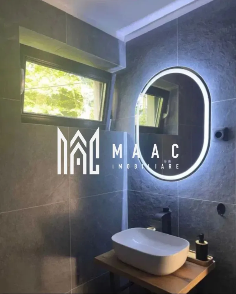 Casă individuală 5 camere | Tocile, Sadu | 250 mp utili, teren 1900 mp - Casă individuală cu 5 camere în Tocile, Sadu, finalizată în 2025, cu 250 mp utili și teren de 1.900 mp. Proprietatea se vinde complet mobilată și utilată, cu finisaje moderne, terasă și curte amenajată, fiind pregătită pentru mutare imediată.

Detalii proprietate:
• Suprafață utilă: 250 mp
• Suprafață construită: 350 mp
• Teren: 1.900 mp
• Compartimentare: living, bucătărie, 4 dormitoare, 5 băi, cameră tehnică și spații de depozitare
• Regim de înălțime: parter, imobil cu 1 nivel
• Construcție finalizată în 2025
• Stare interior: finisat modern
• Se vinde complet mobilată și utilată
• Încălzire în pardoseală în întreaga locuință
• Terasă, balcon, curte amenajată și 1 loc de parcare

Zona Tocile oferă liniște, aer curat și acces rapid către Sibiu, într-un cadru natural potrivit pentru locuire permanentă. Amplasarea la poalele munților completează atmosfera retrasă și intimitatea proprietății.

Cod anunț CP3148342. Contactați-ne pentru detalii suplimentare și pentru programarea unei vizionări.