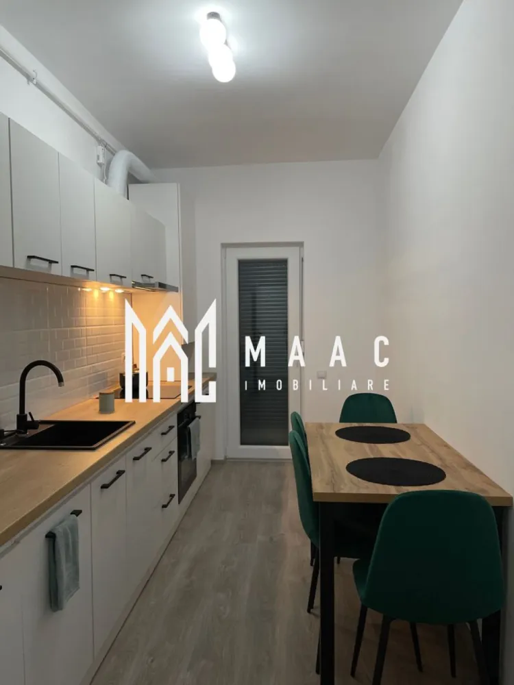 Apartament 2 camere de inchiriat Kaufland Cartierul Arhitecților - MAAC Imobiliare vă propune spre închiriere un apartament cu 2 camere, complet mobilat și utilat, dotat cu încălzire în pardoseală, având o suprafață utilă de 52 mp, situat la etajul 1 al unui imobil construit în anul 2023, pe strada Grigore Ionescu, în Sibiu. Apartamentul este compartimentat eficient și dispune de living luminos, dormitor, bucătărie spațioasă, baie, precum și de un balcon. Proprietatea beneficiază de loc de parcare privat. Locuința este complet utilată cu electrocasnicele necesare pentru un confort imediat: frigider, plită, cuptor electric, aparat de cafea și mașină de spălat rufe. Nu se accepta animale de companie. Imobilul este ideal pentru persoane care își doresc confort, liniște și acces facil către punctele de interes ale orașului. Pentru detalii suplimentare, consultanță sau programarea unei vizionări, va rugăm să ne contactati specificand ID: CP2891713 }}