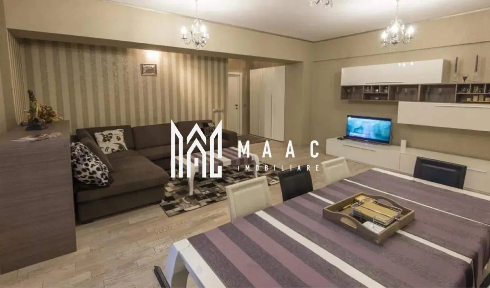 Apartament 3 camere | 110 mp I Zona Mihai Viteazul - MAAC Imobiliare vă propune spre închiriere un apartament cu 3 camere, situat într-o zonă foarte bine cotată pe piața imobiliară – Mihai Viteazu, aproape de școli, grădinițe și principalele puncte de interes ale orașului. Locuința are o suprafață utilă generoasă de 110 mp și este compartimentată eficient, oferind confort și funcționalitate la standarde ridicate. Zona de zi este formată dintr-un living spațios cu bucătărie open-space, completată de două dormitoare mari, două băi luminoase (ambele cu geam) și un balcon. Locuința este complet mobilată și utilată, beneficiind de dotări precum aer condiționat, mașină de spălat rufe, mașină de spălat vase, cuptor și parchet din lemn masiv. În plus, apartamentul dispune de garaj subteran și acces la lift. Se percepe o garantie in valoarea unei chirii lunare. Nu se accepta animale de companie. Pentru mai multe detalii va rugam specificati telefonic ID: CP2904319 }}