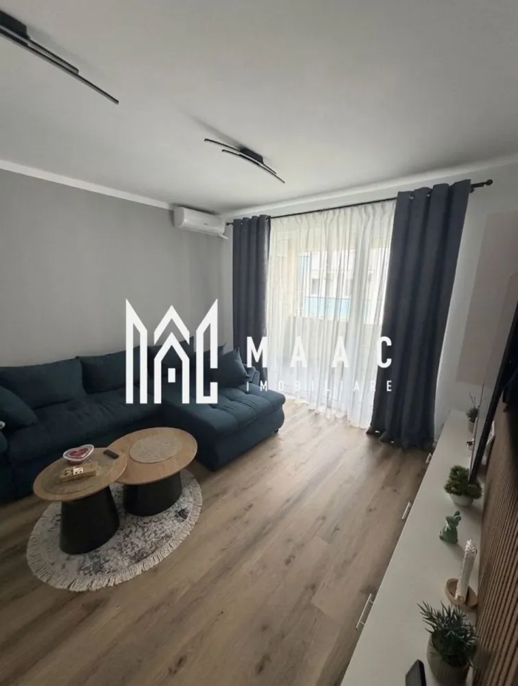 Apartament | 2 camere | 65 MPU | Balcon | Turnișor - MAAC Imobiliare vă propune spre închiriere un apartament spațios și complet mobilat, situat la etajul 1 al unui imobil nou, construit în anul 2024, lânga cartierul Magnolia.

Apartamentul are o suprafață utilă de 70 mp, este decomandat și dispune de un nivel ridicat de confort, fiind ideal pentru un cuplu, o persoană sau o familie.

Caracteristici:
2 camere
1 baie
1 bucătărie separată, complet mobilată și utilată
1 balcon de 9mp

loc propriu de parcare
clasă energetică A
încălzire prin pardoseală
aer condiționat
internet prin cablu și Wi-Fi
bloc izolat termic
parchet și uși interioare din lemn

Utilități:
Apă, canalizare, curent, gaz, telefon și CATV.

Apartamentul se închiriază complet mobilat și utilat, inclusiv cu:
Frigider
Aragaz
Hotă
Cuptor cu microunde
Cafetieră
Mașină de spălat rufe
Mașină de spălat vase
Robot de bucătărie
Sandwich-maker
Toaster
TV
Uscător de păr

Condiții închiriere: garanție în cuantumul unei chirii ,chiriaș pe termen lung

Facilități suplimentare:
Administrare imobil
Menaj
Supraveghere video

Pentru mai multe informații sau programarea unei vizionări, contactați-ne și specificați codul de identificare al proprietății ID: CP3181072.
