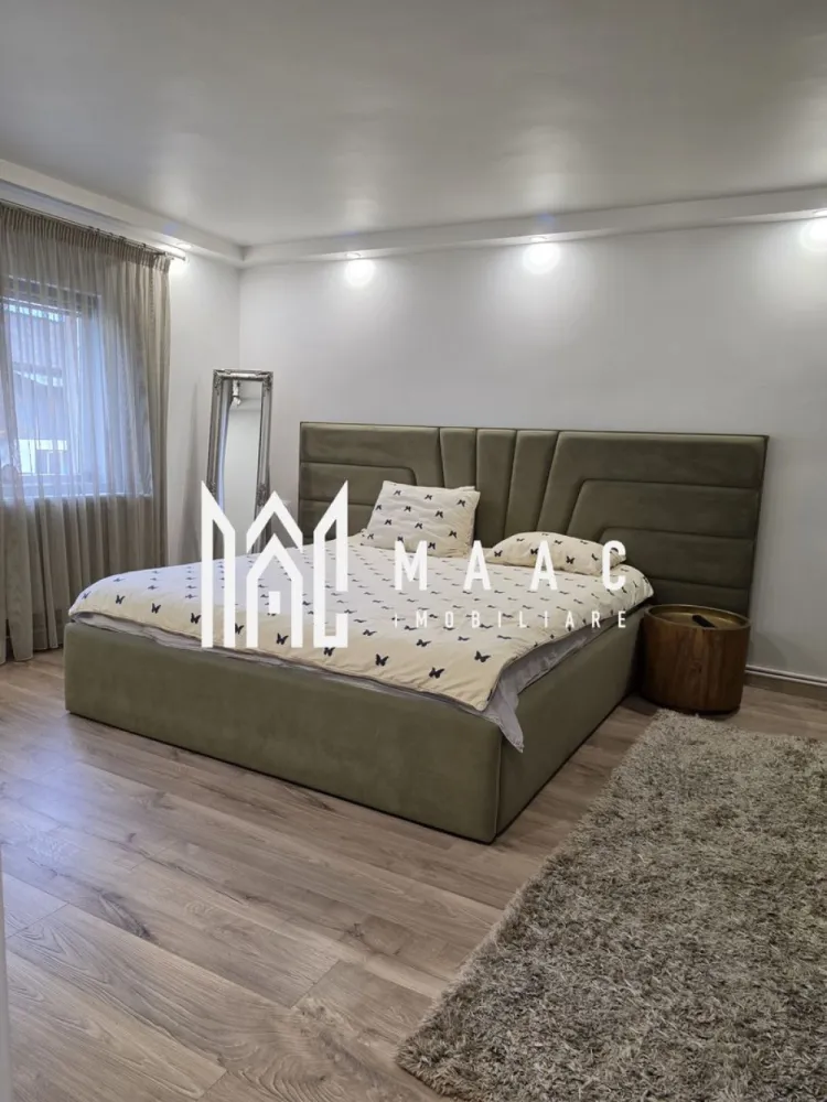 Vila moderna Fedelesoiu | Canalizare | Centrala peleti | Gaz limita proprietate - MAAC Imobiliare vă propune spre vânzare o vilă spectaculoasă, ideală pentru o familie care își dorește confort, spațiu generos și o oază de liniște într-o zonă excelentă din Fedeleșoiu.
________________________________________
• Localizare: Fedeleșoiu, Strada Brigăzii
• Suprafață teren: 650 mp (curte generoasă cu grădină )
• Configurație: Parter + Etaj + Mansardă
• Suprafață utilă parter + etaj: 220 mpu
• Suprafață utilă mansardă: 80 mpu
________________________________________
Parter:
• Living spațios și luminos
• Dormitoare primitoare
• Bucătărie completă
• Baie și hol de acces
Etaj:
• Living secundar / Zonă de relaxare
• Dormitor matrimonial
• Bucătărie proprie (ideal pentru independență sau familii extinse)
• Zonă dedicată pentru lectură
• Dressing spațios
Mansardă:
• Suprafață deschisă de 80 mp
________________________________________
• Încălzire eficientă: Centrală pe peleți KEPO 35 KW
• Apă caldă: Boiler Gorenje performant
• Utilități active: Canalizare racordată, curent electric
• Utilități la poartă: Gaz disponibil la limita proprietății
• Exterior: Curte mare, perfectă pentru relaxare, grătar sau spațiu de joacă
• Facilități zonale: Magazin alimentar în imediata apropiere, acces facil și rapid către oraș
________________________________________
Proprietatea este pregătită pentru a deveni noua dumneavoastră casă. Pentru detalii suplimentare, contactați MAAC Imobiliare, specificand ID 3184480