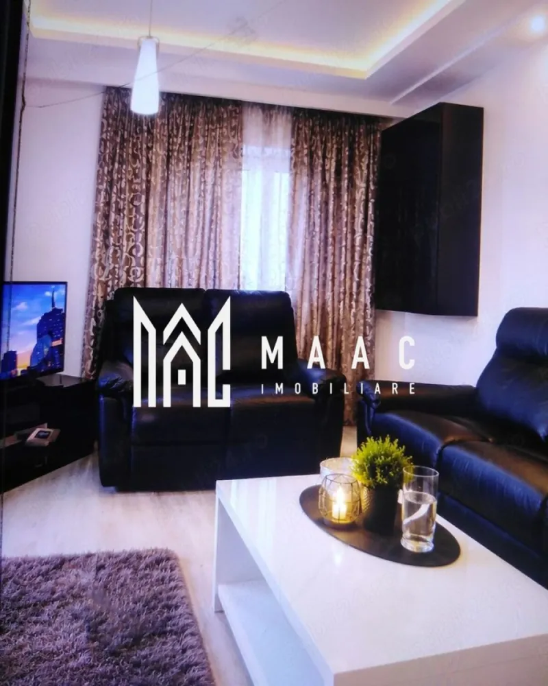 Apartament 3 camere decomandat | Arhitectilor, Sibiu | 70 mp, terasă 40 mp - Apartament cu 3 camere decomandat, situat în zona Arhitectilor - Calea Cisnadiei din Sibiu, cu 70 mp utili, terasă de 40 mp și loc de parcare.

Detalii proprietate:
• Suprafață utilă: 70 mp
• Suprafață construită: 84 mp
• Suprafață totală: 110 mp
• Compartimentare: hol de acces, living cu bucătărie open-space, două dormitoare, baie și terasă de 40 mp
• Etaj 3 din 3, imobil finalizat în 2020
• Se vinde complet mobilat și utilat
• Dotări: aer condiționat, combină frigorifică, mașină de spălat, plită electrică, cuptor pe gaz și televizor
• 1 loc de parcare

Zona Arhitectilor - Calea Cisnadiei oferă acces rapid către magazine, supermarketuri, farmacii, școli, grădinițe și mijloace de transport în comun, fiind o opțiune practică pentru locuire în Sibiu.

Cod anunț CP3184185. Contactați echipa MAAC Imobiliare pentru detalii suplimentare și programarea unei vizionări.