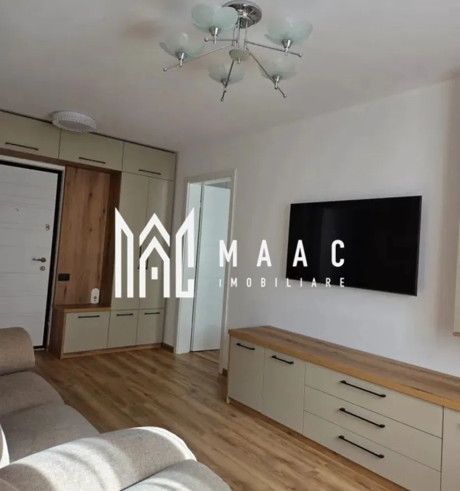 Apartament 2 camere decomandat | Valea Aurie, Sibiu | 47 mp, prima chirie - Apartament cu 2 camere decomandat de închiriat în Sibiu, în zona Valea Aurie, cu 47 mp utili, situat la etajul 2 din 4, renovat și pregătit pentru mutare imediată.

Detalii proprietate:
• Suprafață utilă: 47 mp
• Suprafață construită: 55 mp
• Apartament cu 2 camere decomandat
• Etaj 2 din 4
• An construcție: 1989
• Stare interior: renovat
• Complet mobilat și utilat
• Două balcoane
• Disponibil imediat
• Oferit la prima chirie

Valea Aurie este o zonă rezidențială apreciată din Sibiu, cu acces rapid către Parcul Sub Arini, Pădurea Dumbrava, zona Zoo, magazine, farmacii, școli și mijloace de transport.

Cod anunț CP3185788. Contactați echipa MAAC Imobiliare pentru informații suplimentare și pentru programarea unei vizionări.