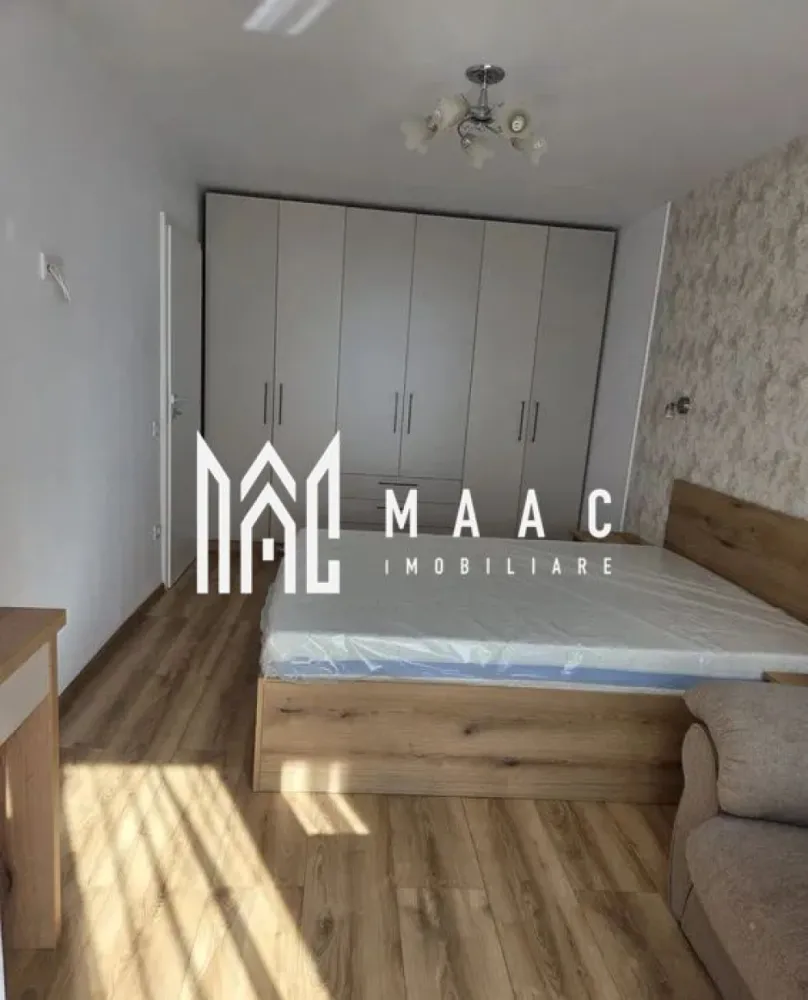 Apartament 2 camere decomandat | Valea Aurie, Sibiu | 47 mp, prima chirie - Apartament cu 2 camere decomandat de închiriat în Sibiu, în zona Valea Aurie, cu 47 mp utili, situat la etajul 2 din 4, renovat și pregătit pentru mutare imediată.

Detalii proprietate:
• Suprafață utilă: 47 mp
• Suprafață construită: 55 mp
• Apartament cu 2 camere decomandat
• Etaj 2 din 4
• An construcție: 1989
• Stare interior: renovat
• Complet mobilat și utilat
• Două balcoane
• Disponibil imediat
• Oferit la prima chirie

Valea Aurie este o zonă rezidențială apreciată din Sibiu, cu acces rapid către Parcul Sub Arini, Pădurea Dumbrava, zona Zoo, magazine, farmacii, școli și mijloace de transport.

Cod anunț CP3185788. Contactați echipa MAAC Imobiliare pentru informații suplimentare și pentru programarea unei vizionări.