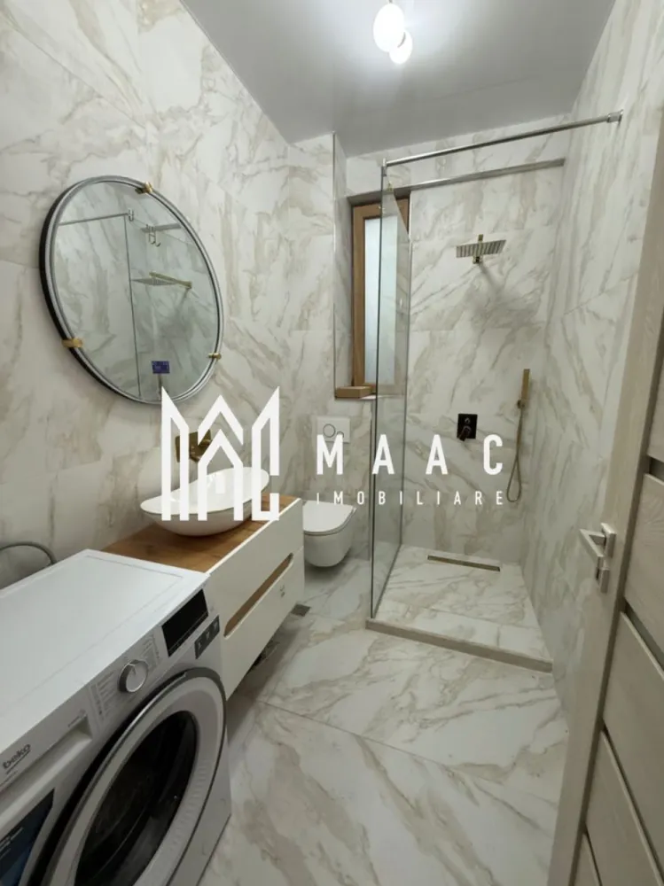 Apartament 2 camere de vânzare | Șelimbăr, Sibiu | 62 mp, mobilat, balcon - Apartament cu 2 camere de vânzare în Șelimbăr, zona Doamna Stanca, cu 62 mp utili, situat la etajul 2 al unui imobil finalizat în 2022, potrivit pentru mutare imediată.

Detalii proprietate:
• Suprafață utilă: 62 mp
• Compartimentare: dormitor matrimonial, living cu bucătărie open-space, baie cu geam pentru ventilație naturală, hol și balcon
• Etaj 2 din 3
• Imobil finalizat în 2022
• Structură din cărămidă
• Apartamentul se vinde mobilat și utilat
• Balcon potrivit pentru relaxare
• Baie cu geam pentru aerisire naturală

Locuința este amplasată în zona Doamna Stanca, cu acces rapid către centre comerciale, instituții de învățământ, farmacii, mijloace de transport și alte puncte de interes din zonă.

Pentru detalii suplimentare și programarea unei vizionări, contactați echipa MAAC Imobiliare și menționați Cod anunț CP3186815.