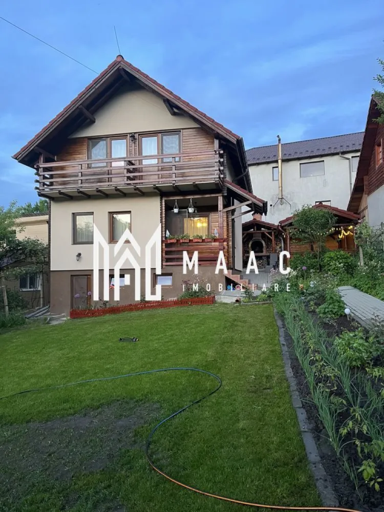 Casa | Tocile | 4 camere | Teren 500 mp - MAAC Imobiliare va prezinta o casa de vacanta pe structura de lemn cu suprafata de 120 mp utili si teren de 500 mp. Casa se preda complet mobilata si utilata dupa cum se vede in imagini. Compartimentarea este in felul urmator: Parter: living cu bucatarie open-space si baie Etaj: 3 dormitoare si baie De asemenea proprietatea ofera pivnita, zona pentru gratar si o gradina spatioasa. Pentru mai multe informatii, precizati telefonic ca ati vizionat anuntul cu ID: CP1951632. }}