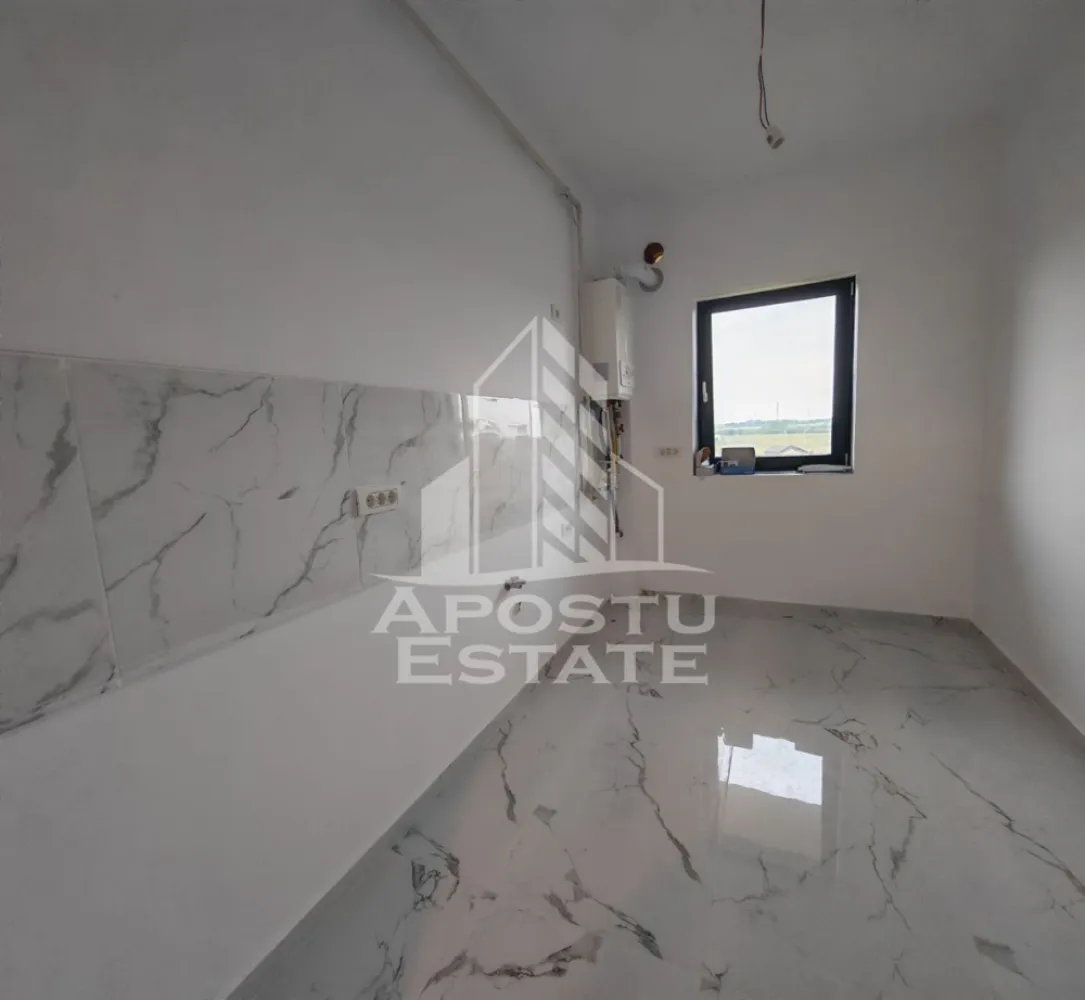 Apartament nou de vanzare, 2 camere, bucatarie inchisa, Giroc - Apostu Estate va ofera spre vanzare un apartament nou, cu 2 camere, decomandat, cu bucatarie inchisa, situat la etajul 3 al unui imobil intabulat in anul 2025, in Timis, Giroc, zona Calea Urseni. Aproximativ 1 km distanta fata de Zone Cafe 2 si Mega Image Calea Urseni Timisoara. Acces facil la centura ocolitoare a orasului. Doar 300 m fata de prima statie a mijloacelor de transport in comun.

Imobil realizat din caramida Porotherm de 30 cm pe exterior, 25 cm zidurile pe interior si 11.5 zidurile de compartimentare la bai.
Izolatie de 10 cm EPS 80.
Acoperis din tigla.

Loc de parcare propriu inscris in cartea funciara.
Patru apartamente pe etaj. 
Regim de inaltime: P + 2 + M. 
Acoperis din tigla. 
Tamplarie PVC, geamuri tripan.

Confortul termic se realizeaza cu ajutorul centralei proprii pe gaz, incalzire in pardoseala.

Apartamentul dispune de 53 mpu, plus un balcon de aproximativ 5 - 6 mp. 
Compartimentat astfel:
- hol de acces generos
- bucatarie inchisa, 8 mp
- living, 18.5 mp
- dormitor, 14 mp
- baie cu dus, rigola si toaleta suspendata cu rezervor incorporat, 5 mp
- balcon deschis 

Agentia imobiliara Apostu Estate va ofera consultanta bancara gratuita prin intermediul colaboratorilor nostri pentru alegerea celui mai potrivit tip de credit, astfel incat tu sa devi noul proprietar al acestui apartament.

Va asteptam cu drag la o vizionare!